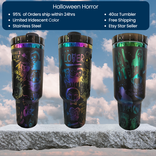 three different colored tumblers sitting on top of a rock