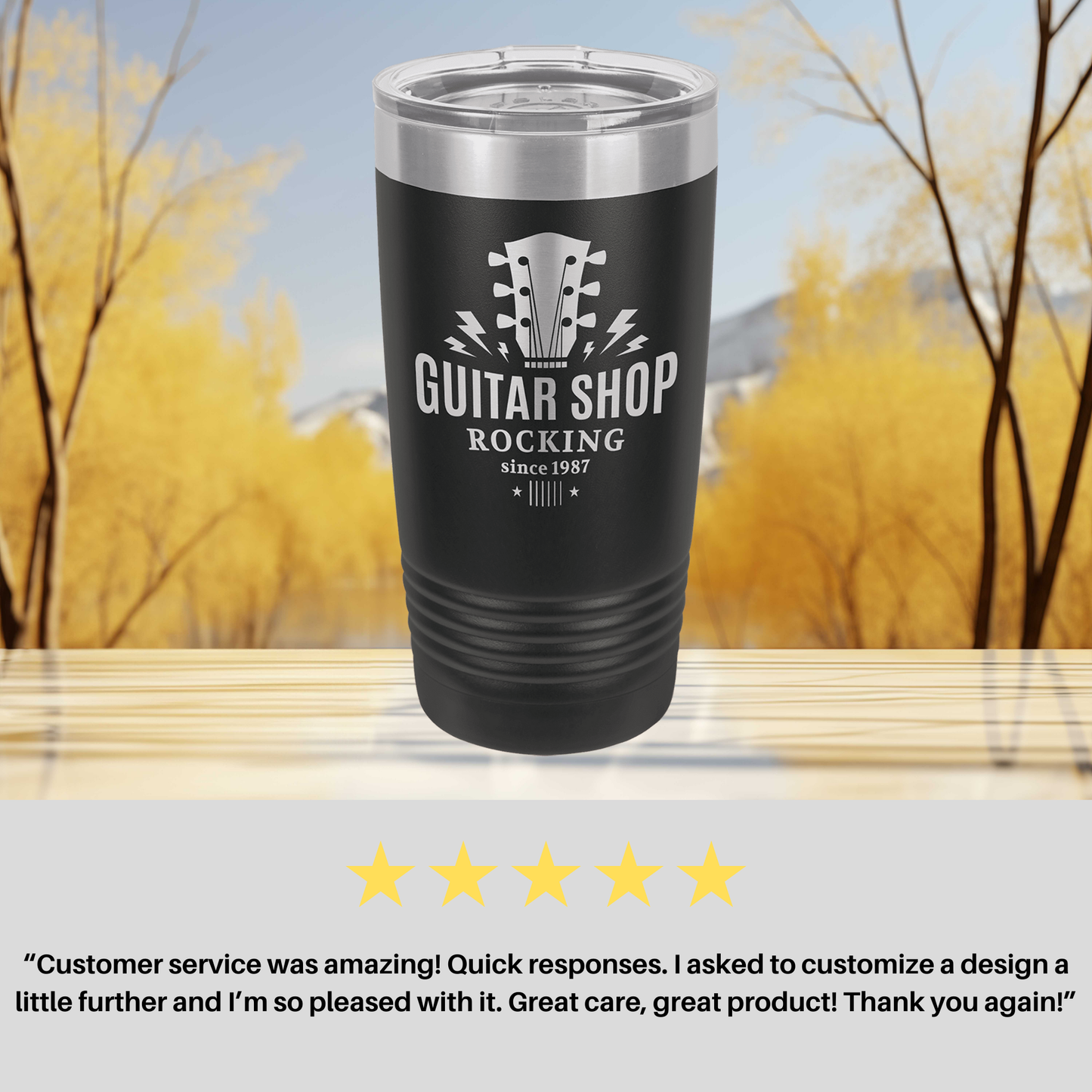 a black tumbler cup sitting on top of a table