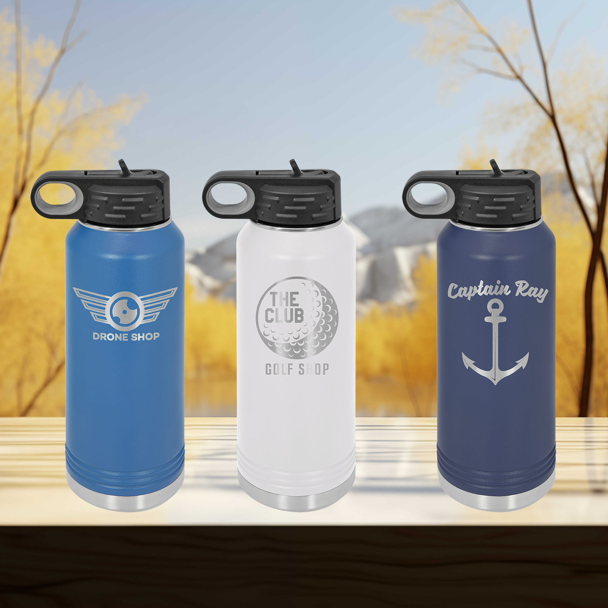 a group of three water bottles sitting on top of a wooden table