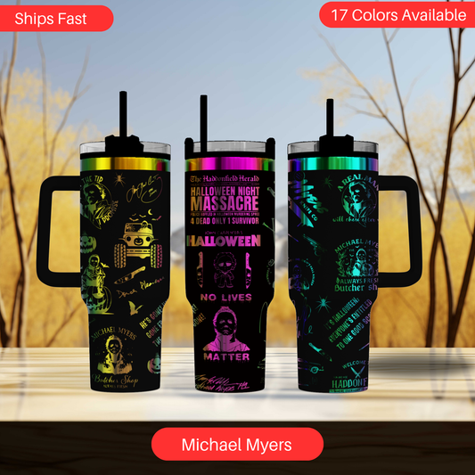 three travel mugs with different designs on them