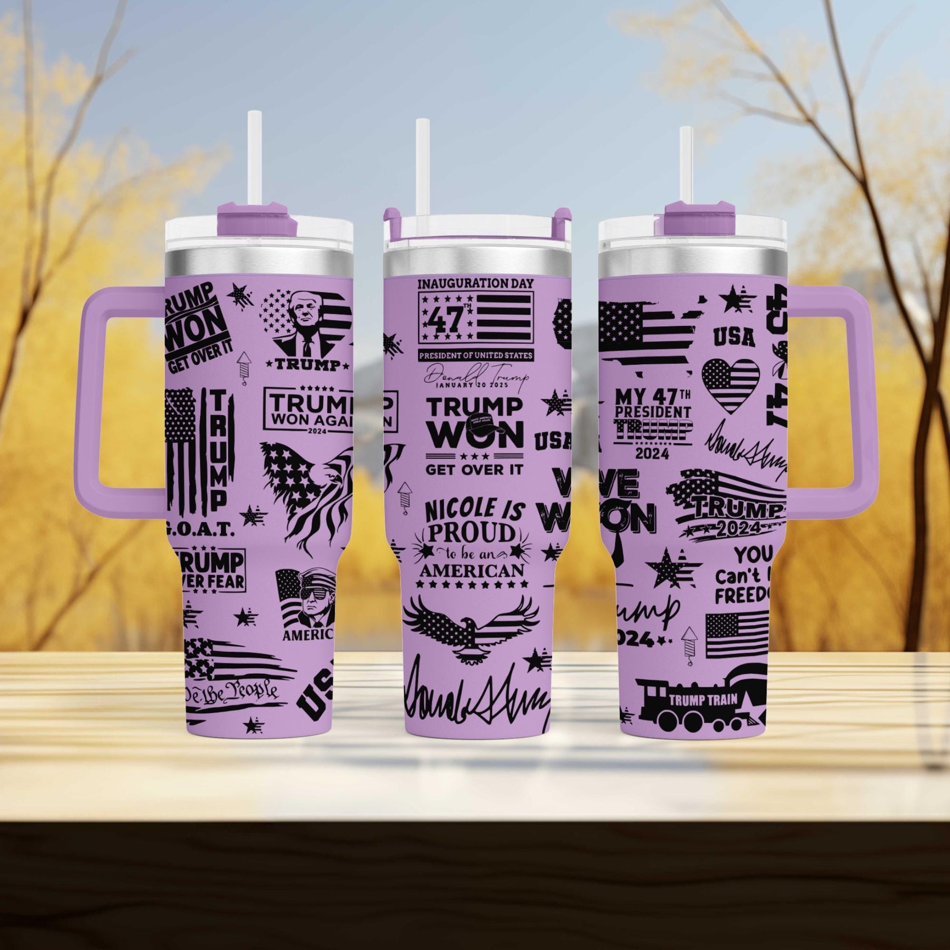 three travel mugs sitting on top of a wooden table