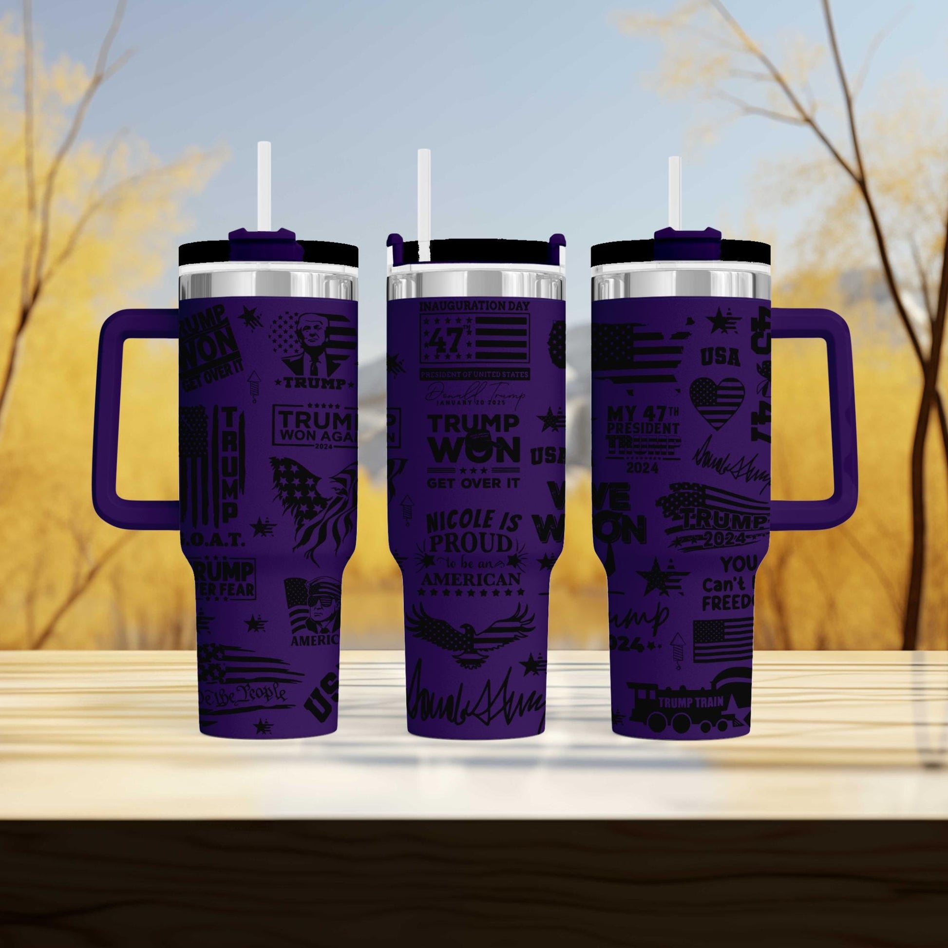 three travel mugs sitting on top of a wooden table