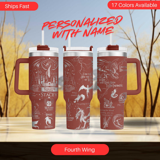 three red travel mugs sitting on top of a table