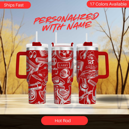 three red travel mugs sitting on top of a table