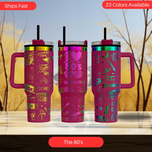 a set of three colorful tumblers sitting on top of a table