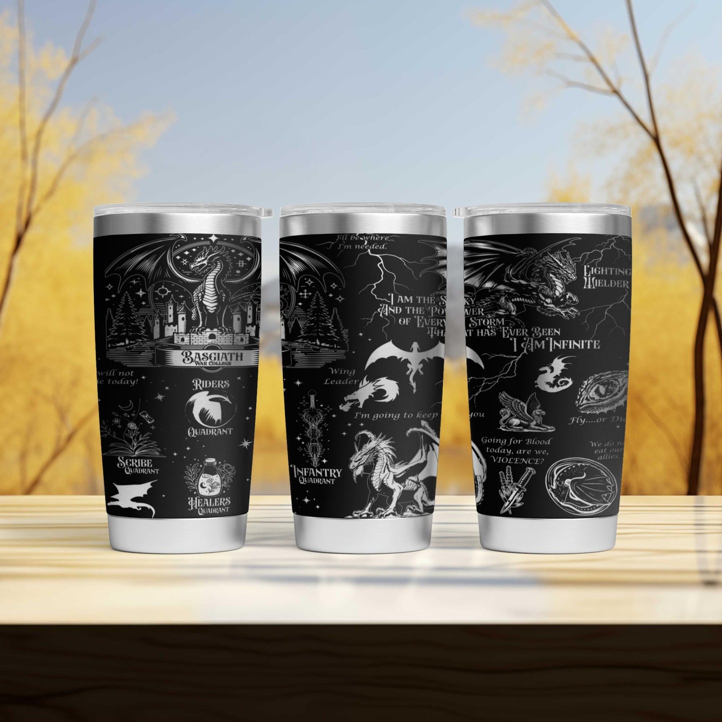 three harry potter travel mugs sitting on a table