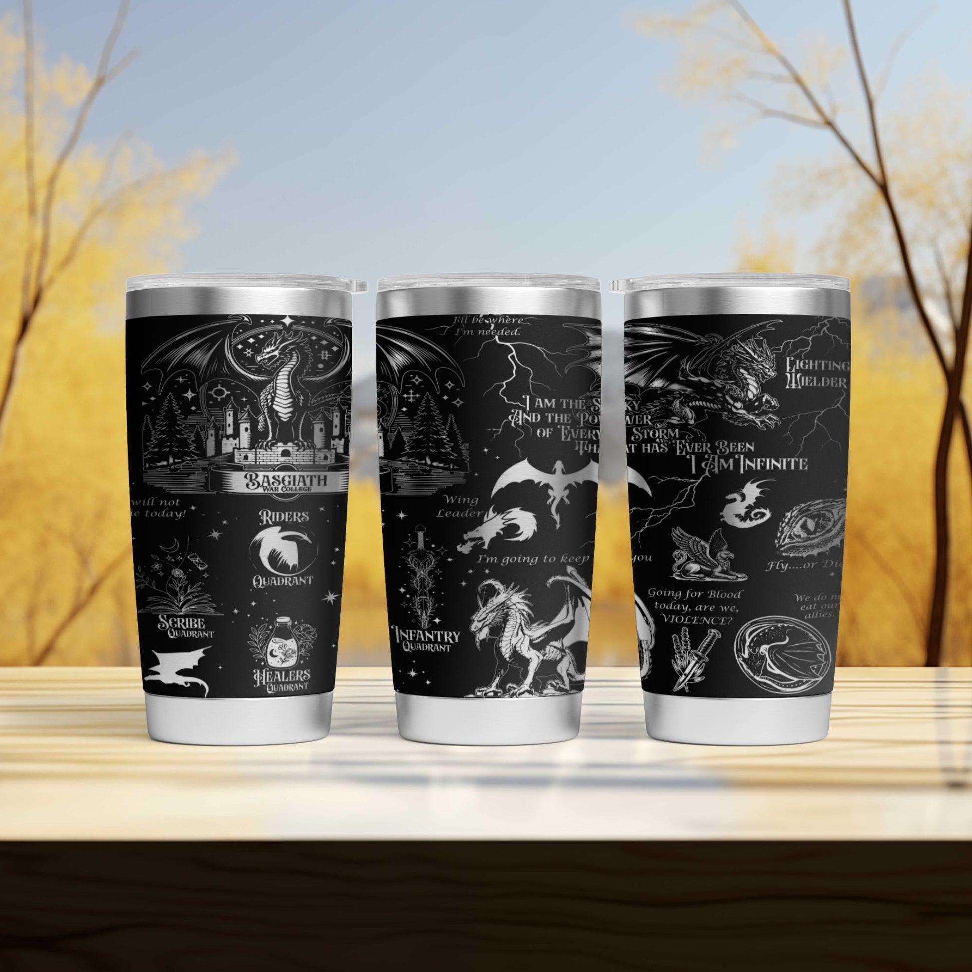 three harry potter travel mugs sitting on a table