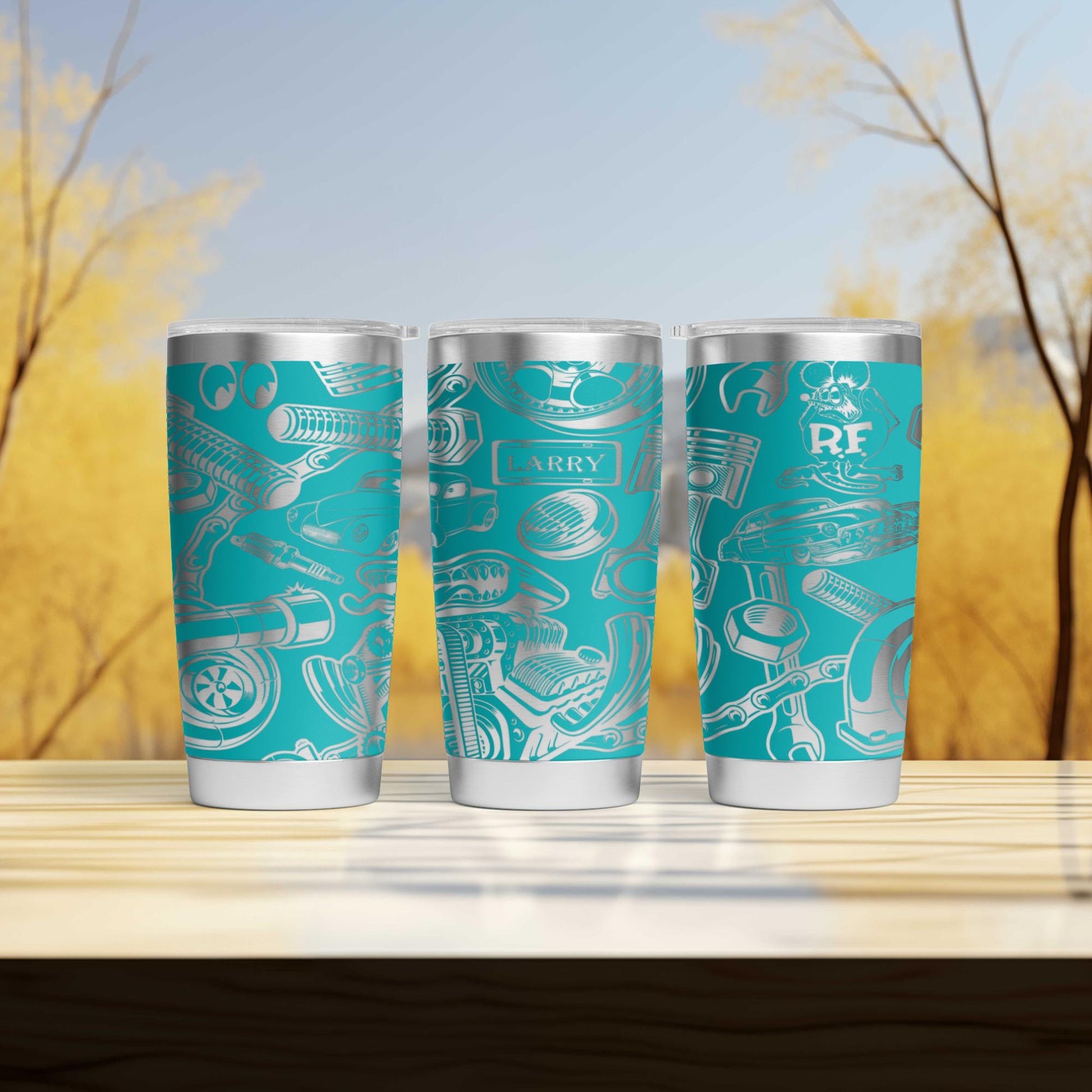 three tumblers sitting on top of a wooden table