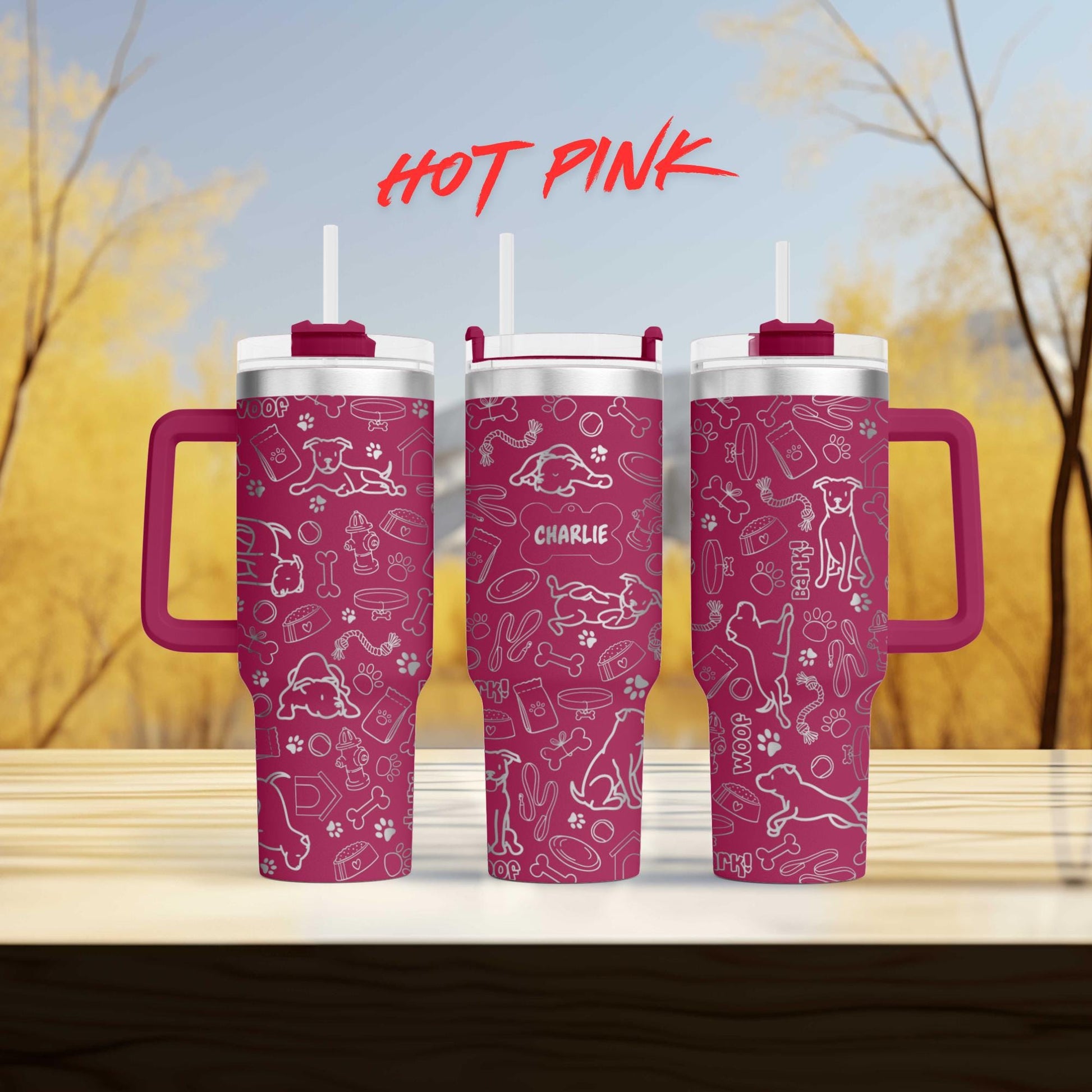 a couple of pink cups sitting on top of a wooden table