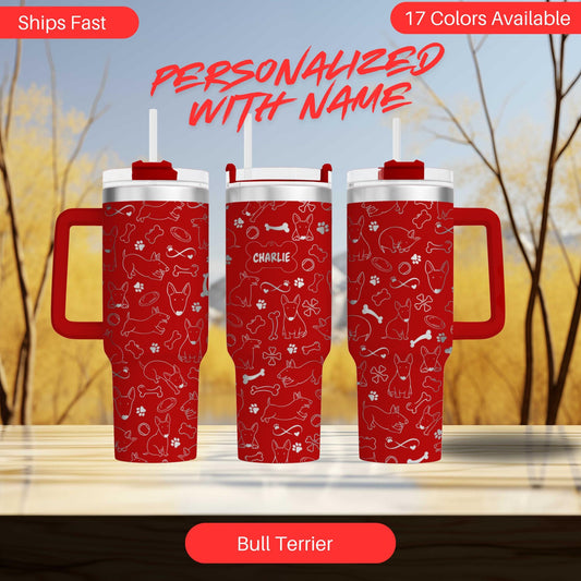 three red travel mugs sitting on top of a table