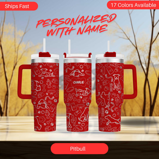 two red travel mugs sitting on top of a table