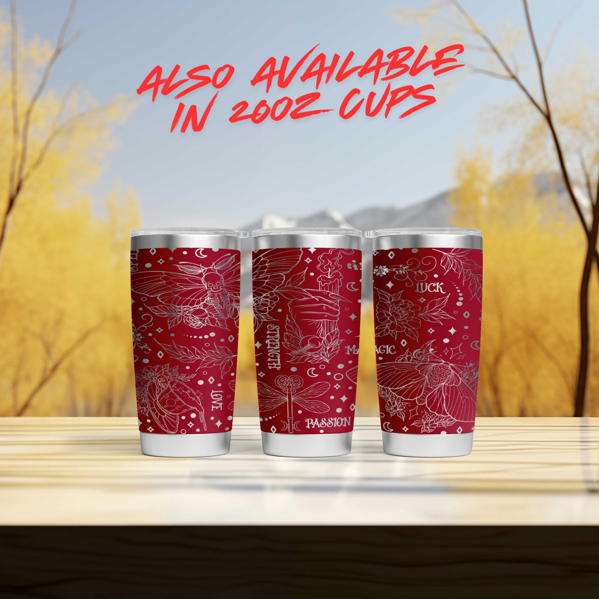 three red cups sitting on top of a wooden table