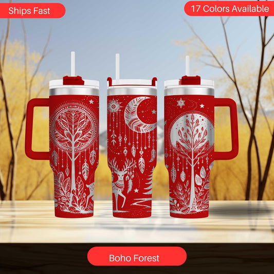 three red travel mugs sitting on top of a table