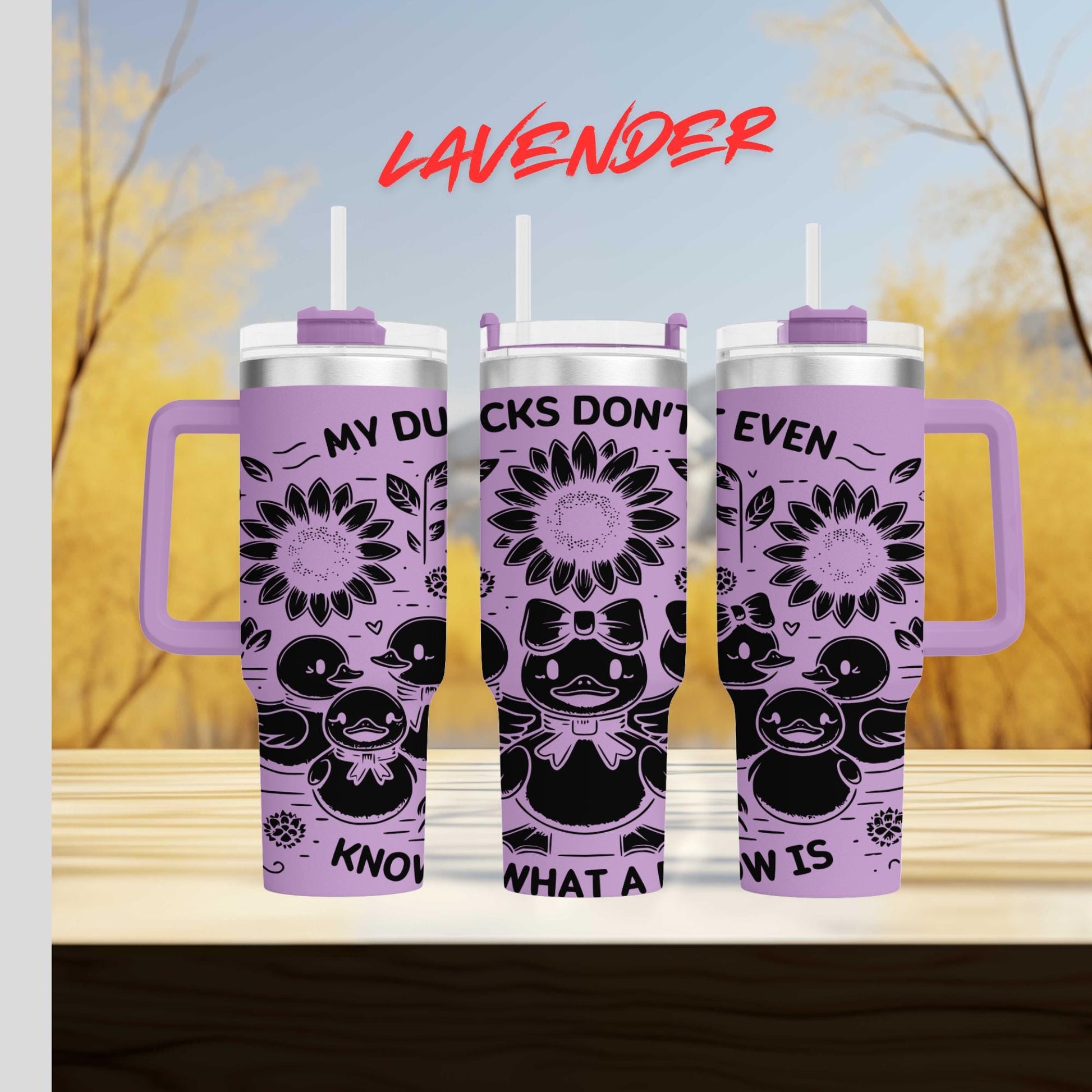 a couple of purple cups sitting on top of a wooden table