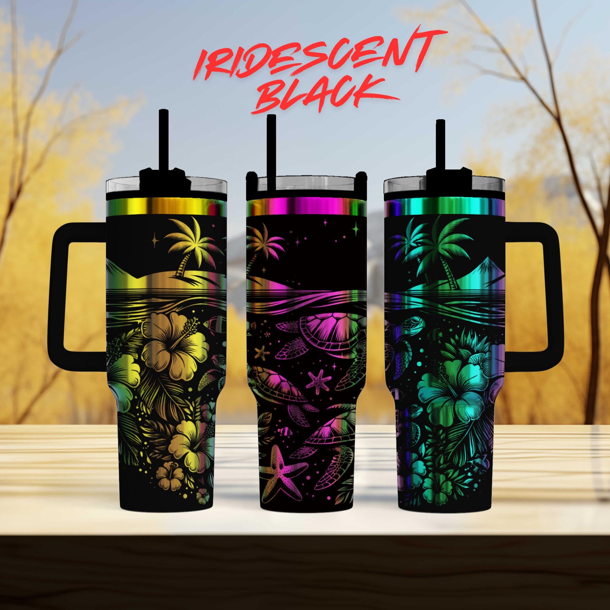 three colorful tumblers sitting on top of a wooden table