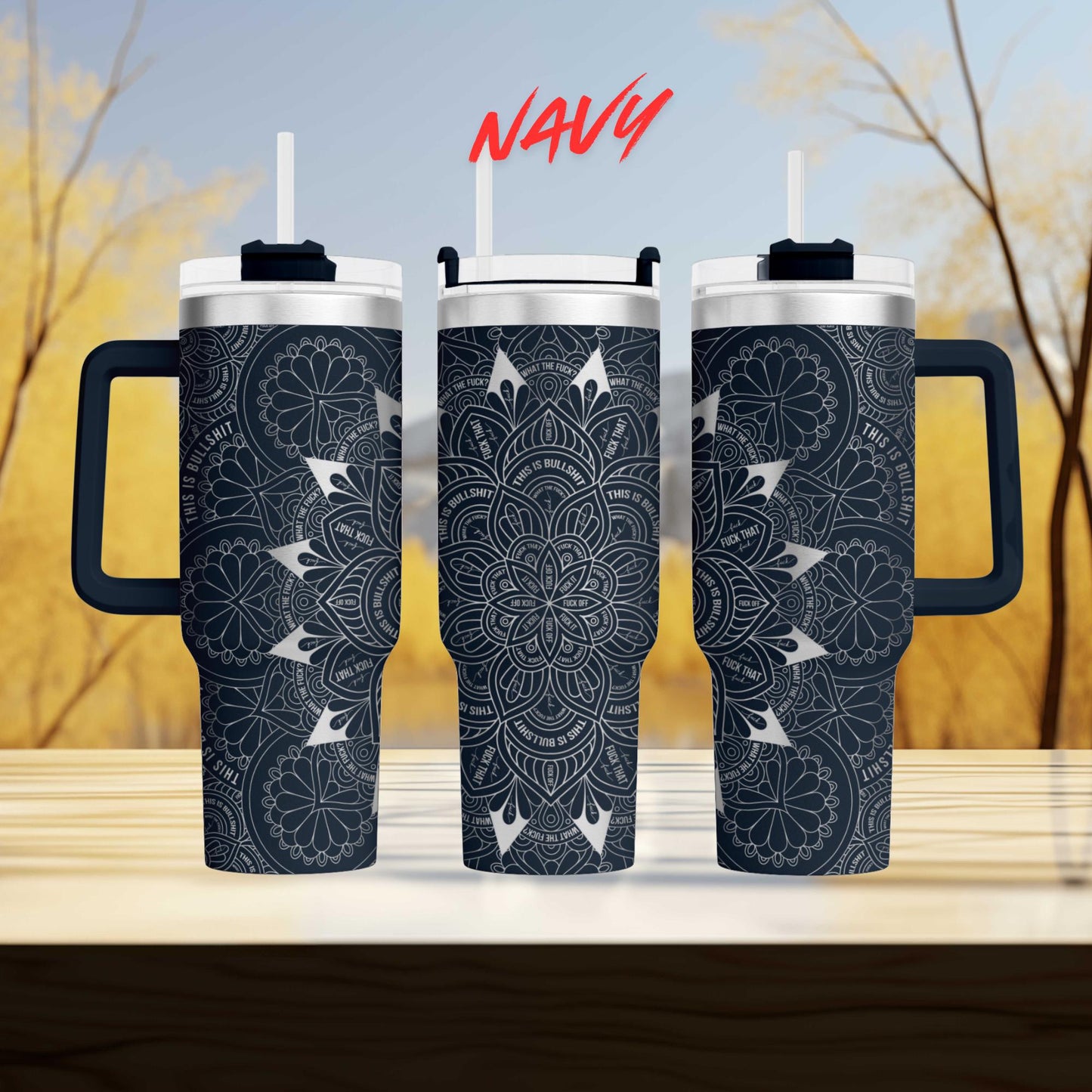 three travel mugs sitting on top of a wooden table