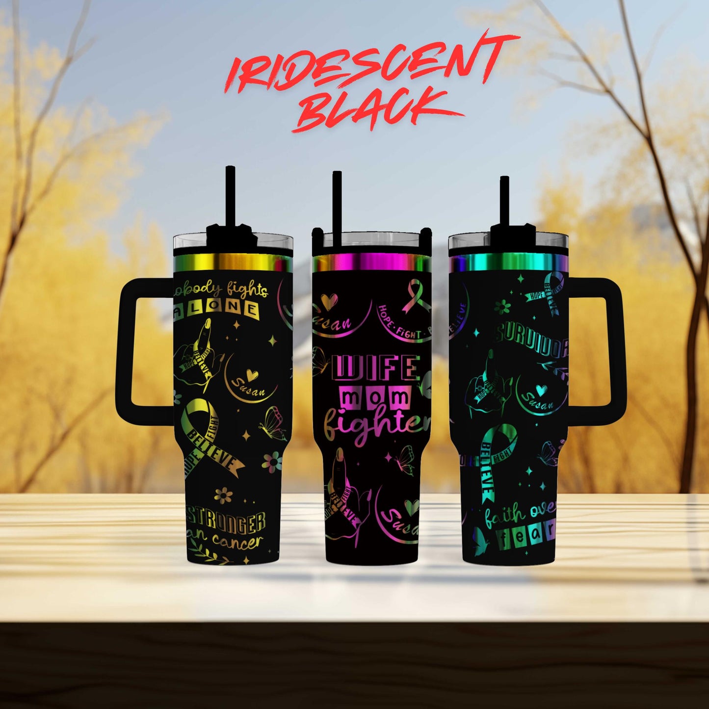 three different colored tumblers sitting on top of a table