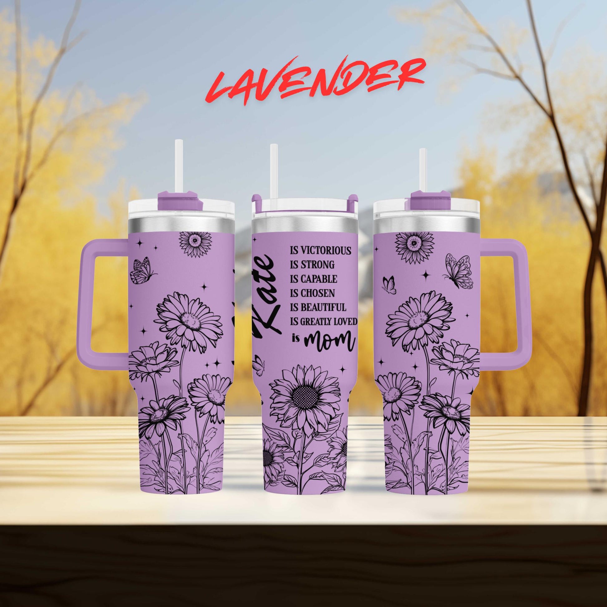 three travel mugs sitting on top of a wooden table