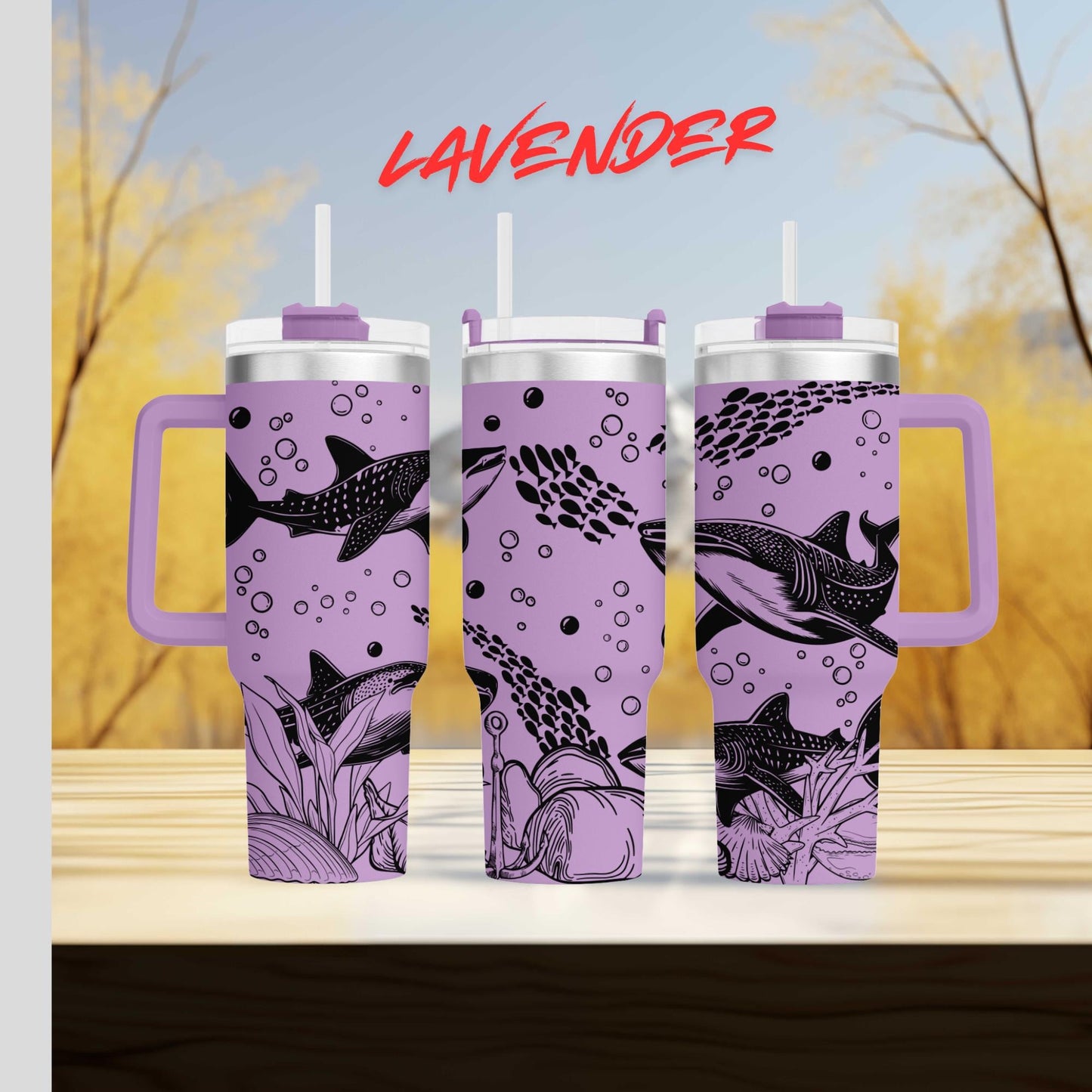 a set of three travel mugs sitting on top of a table