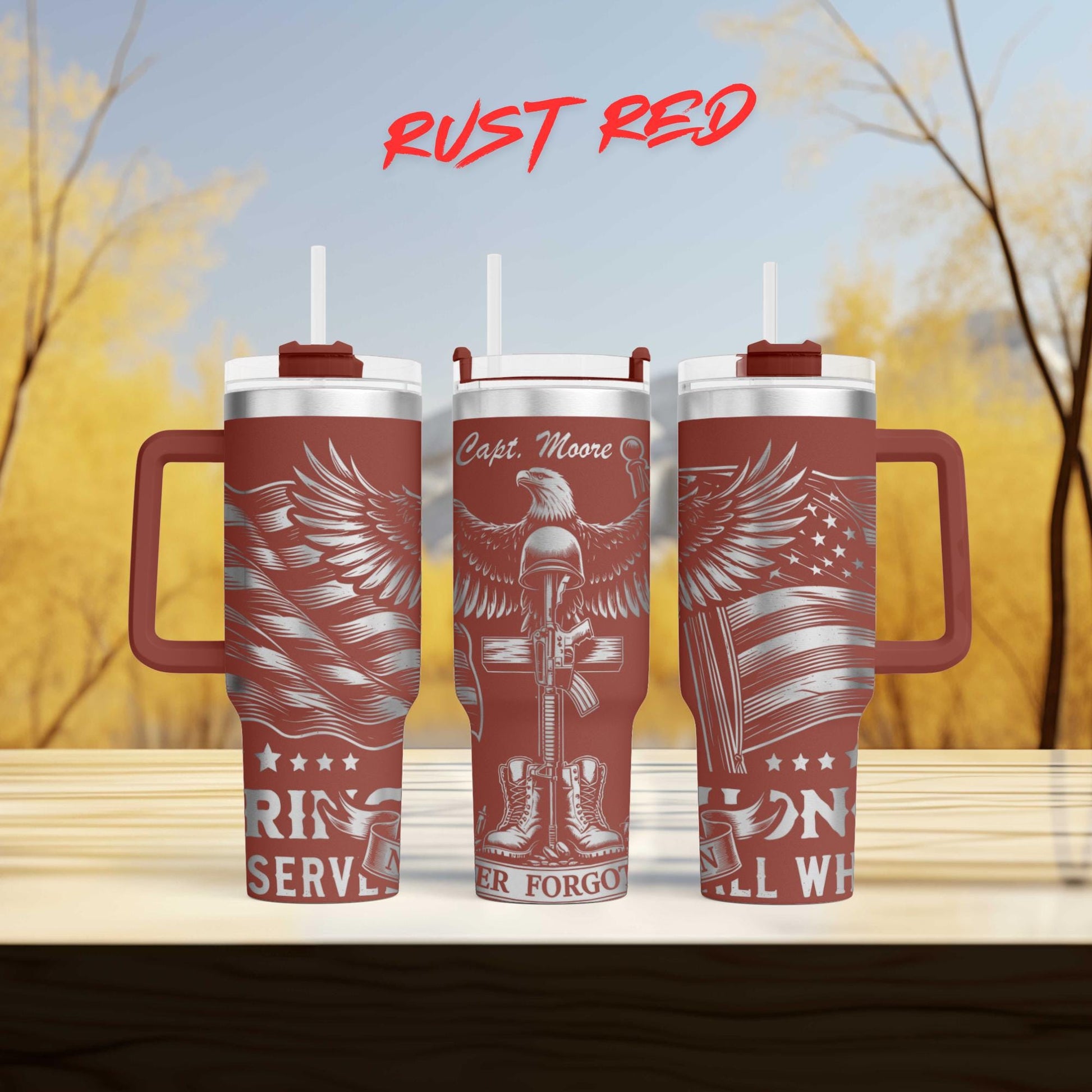 three red travel mugs sitting on top of a wooden table