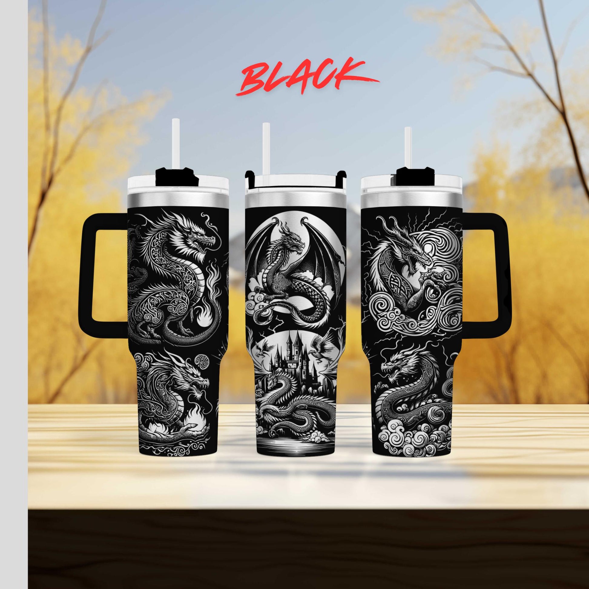 three travel mugs with designs on them sitting on a table