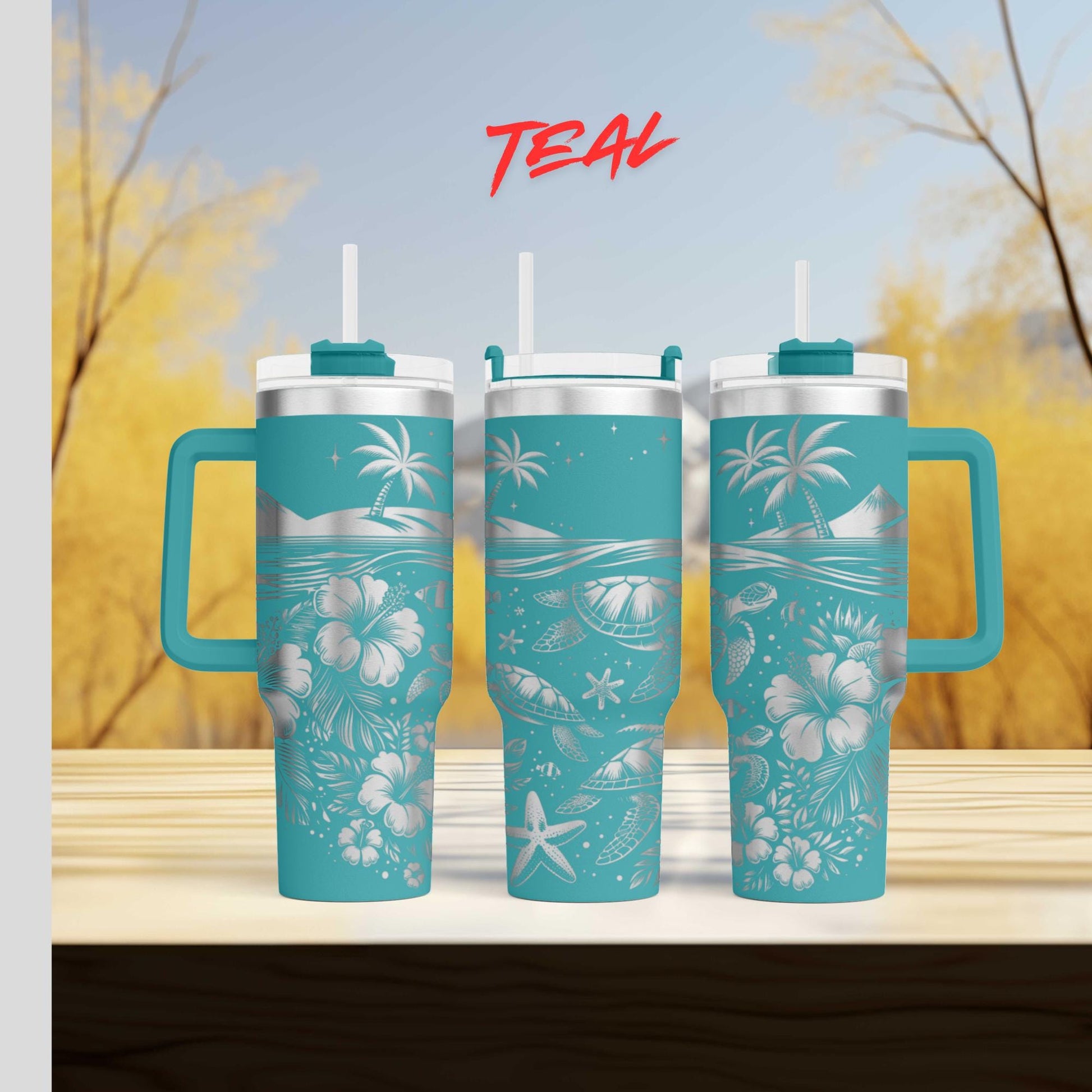 three teal travel mugs sitting on top of a wooden table