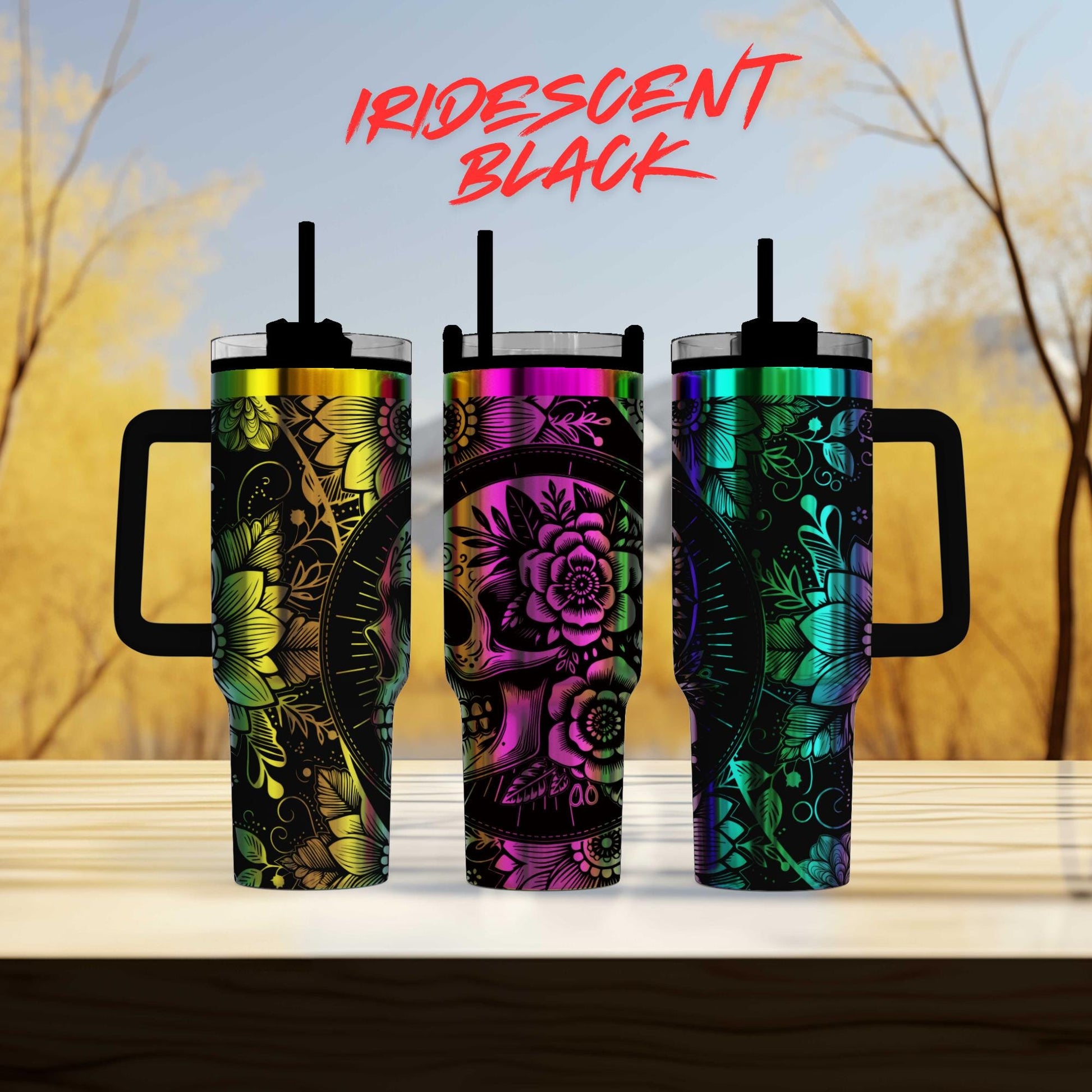 three colorful tumblers sitting on top of a wooden table