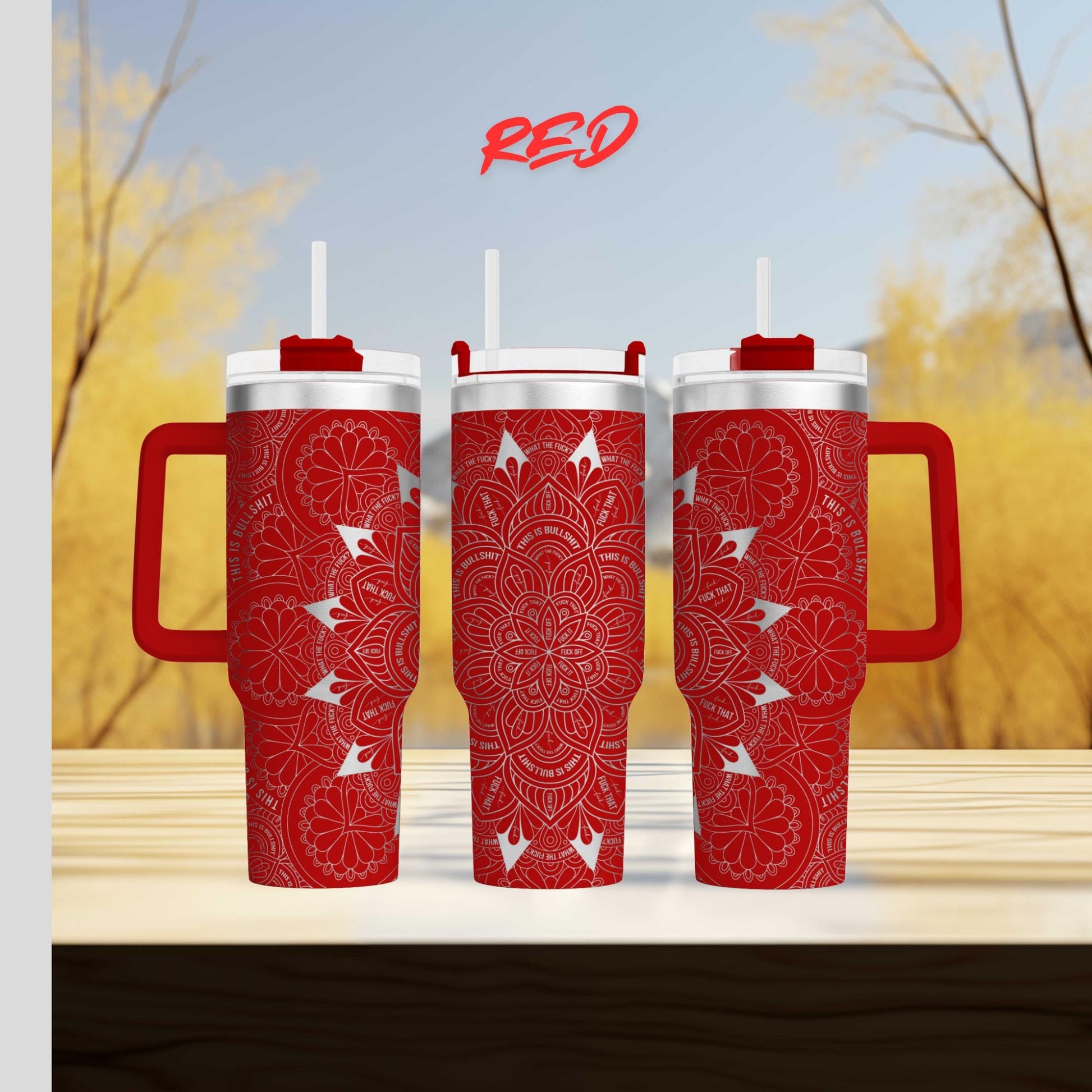 three red coffee mugs sitting on top of a wooden table