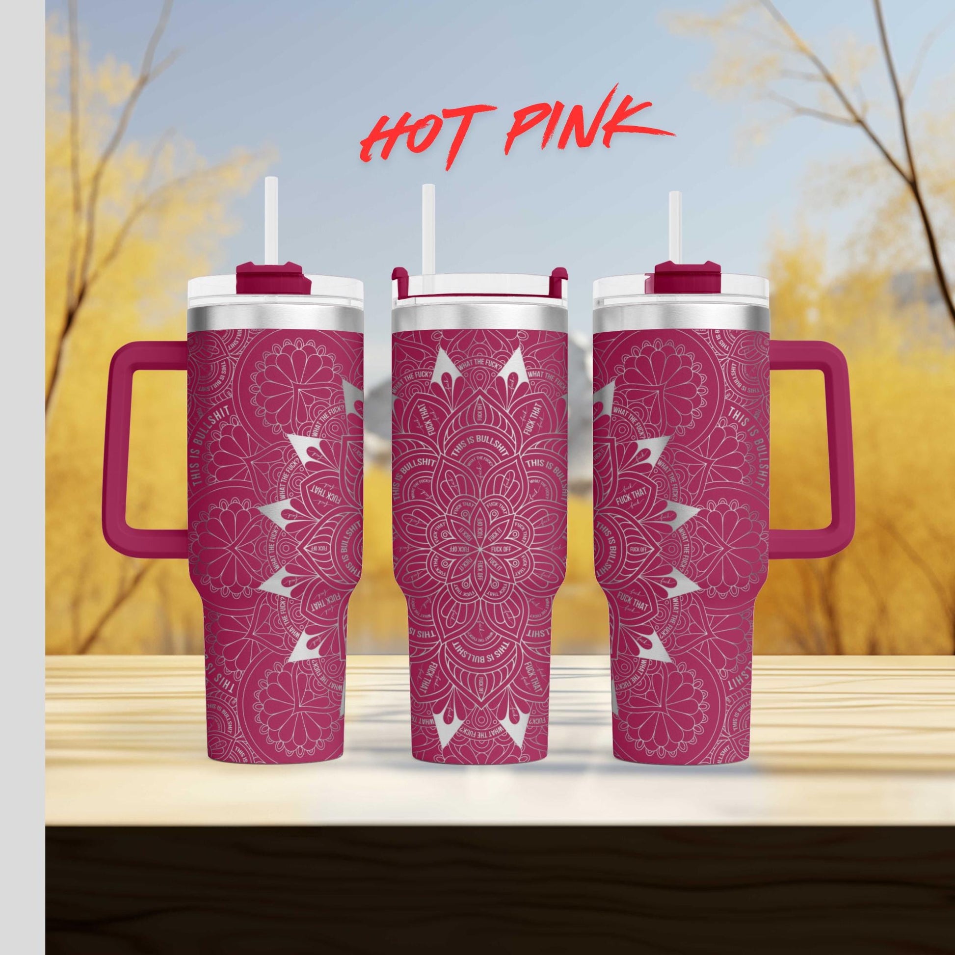 three pink coffee mugs sitting on top of a wooden table