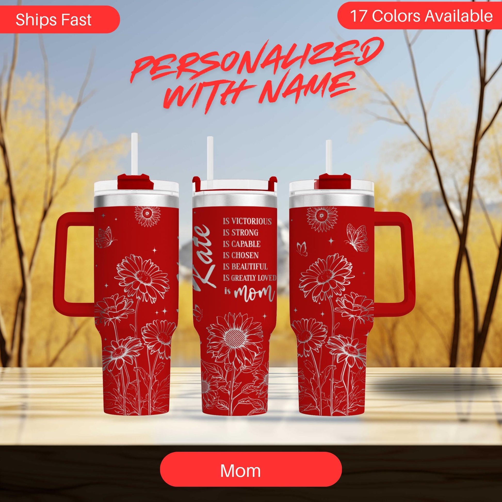 three red travel mugs sitting on top of a table