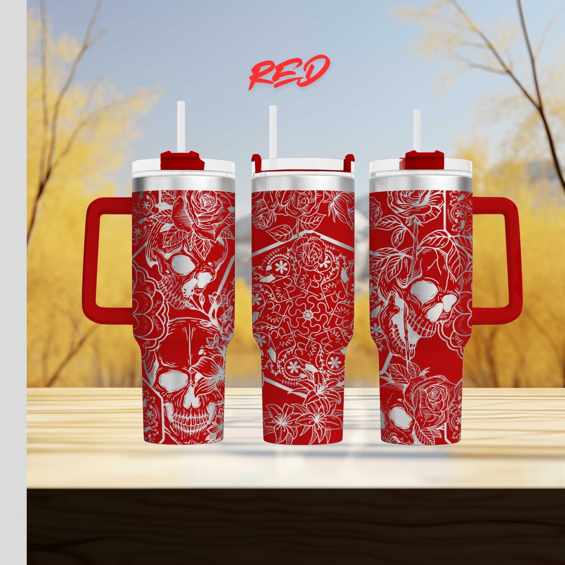 three red coffee mugs sitting on top of a wooden table