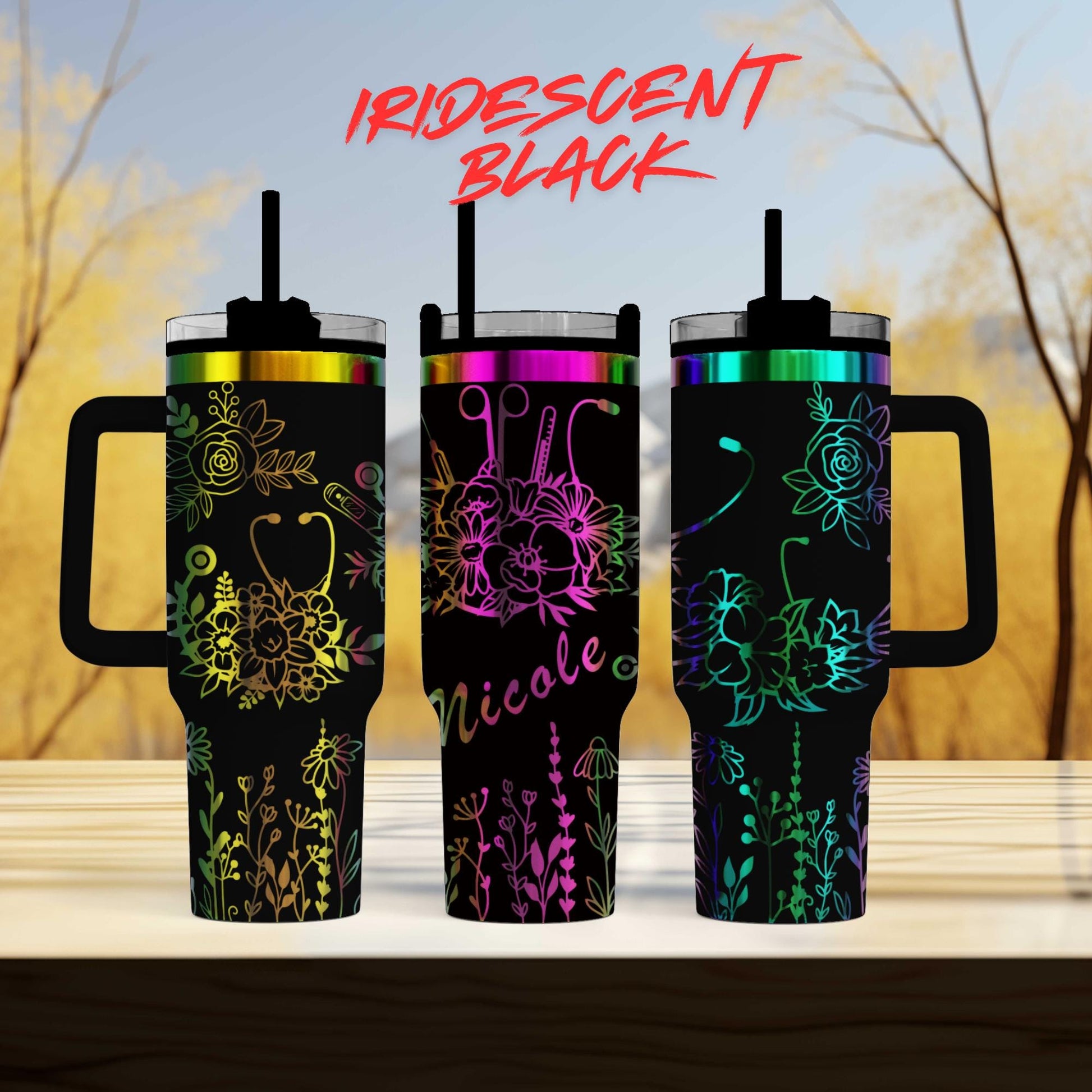 three different colored tumblers sitting on top of a table