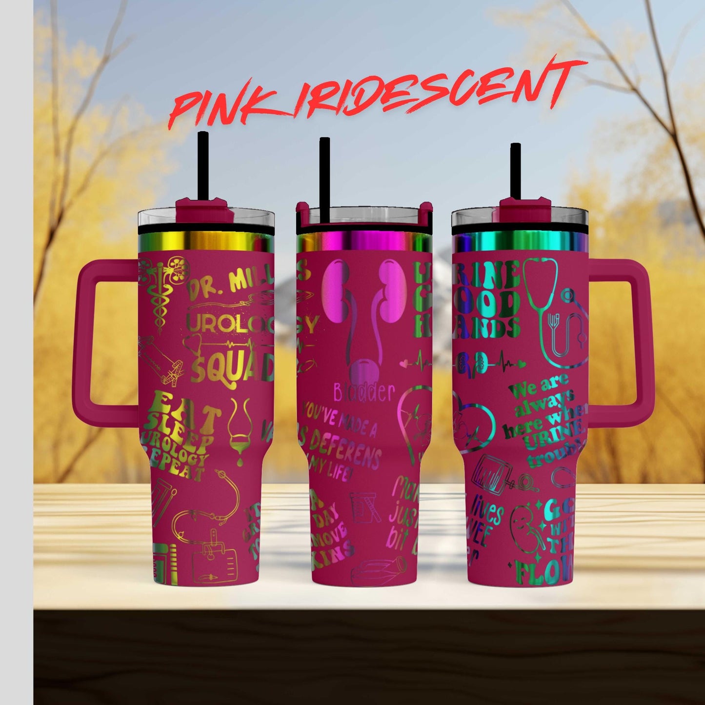 a set of three pink travel mugs sitting on top of a wooden table
