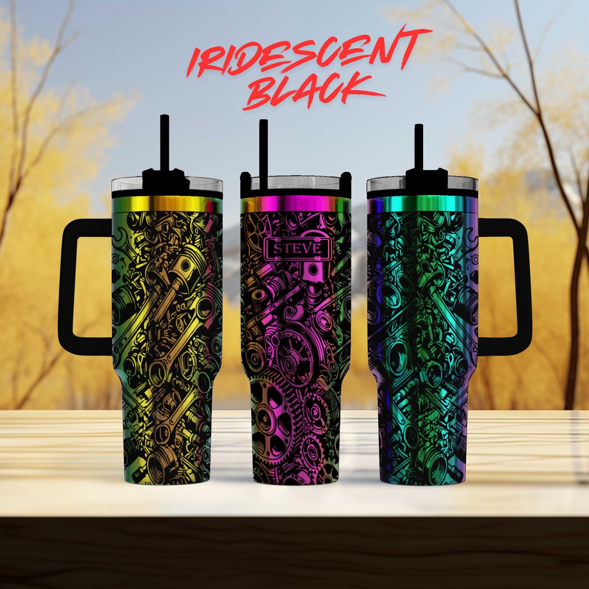 three colorful tumblers sitting on top of a wooden table