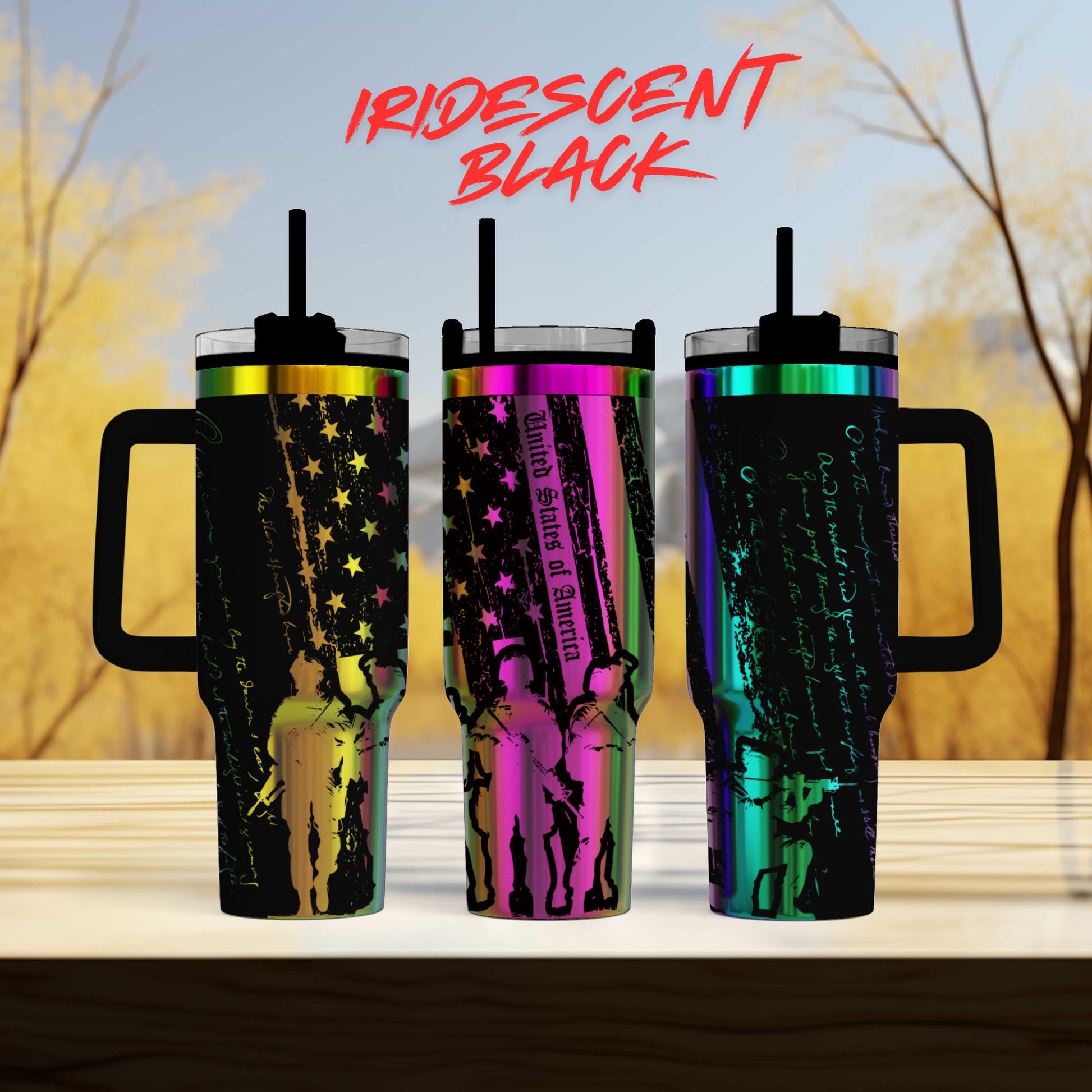 three different colored tumblers sitting on top of a table