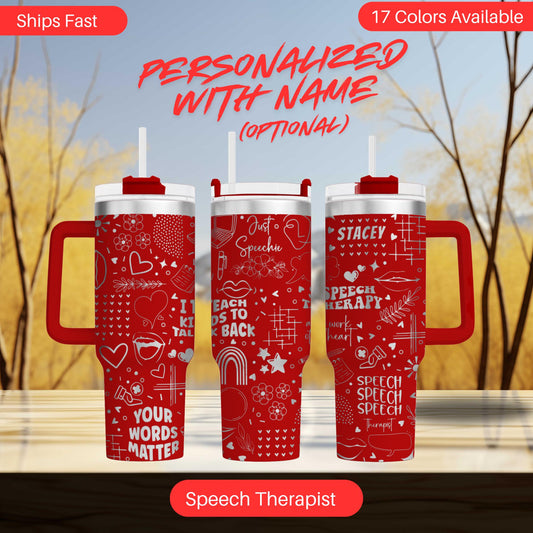 three red tumblers with white text and graphics printed on them. The text includes phrases such as "Personalized with Name", "Just a speech", "Speech Therapist", and "Your words matter". The background of the image is a blurred outdoor scene with trees and a blue sky.