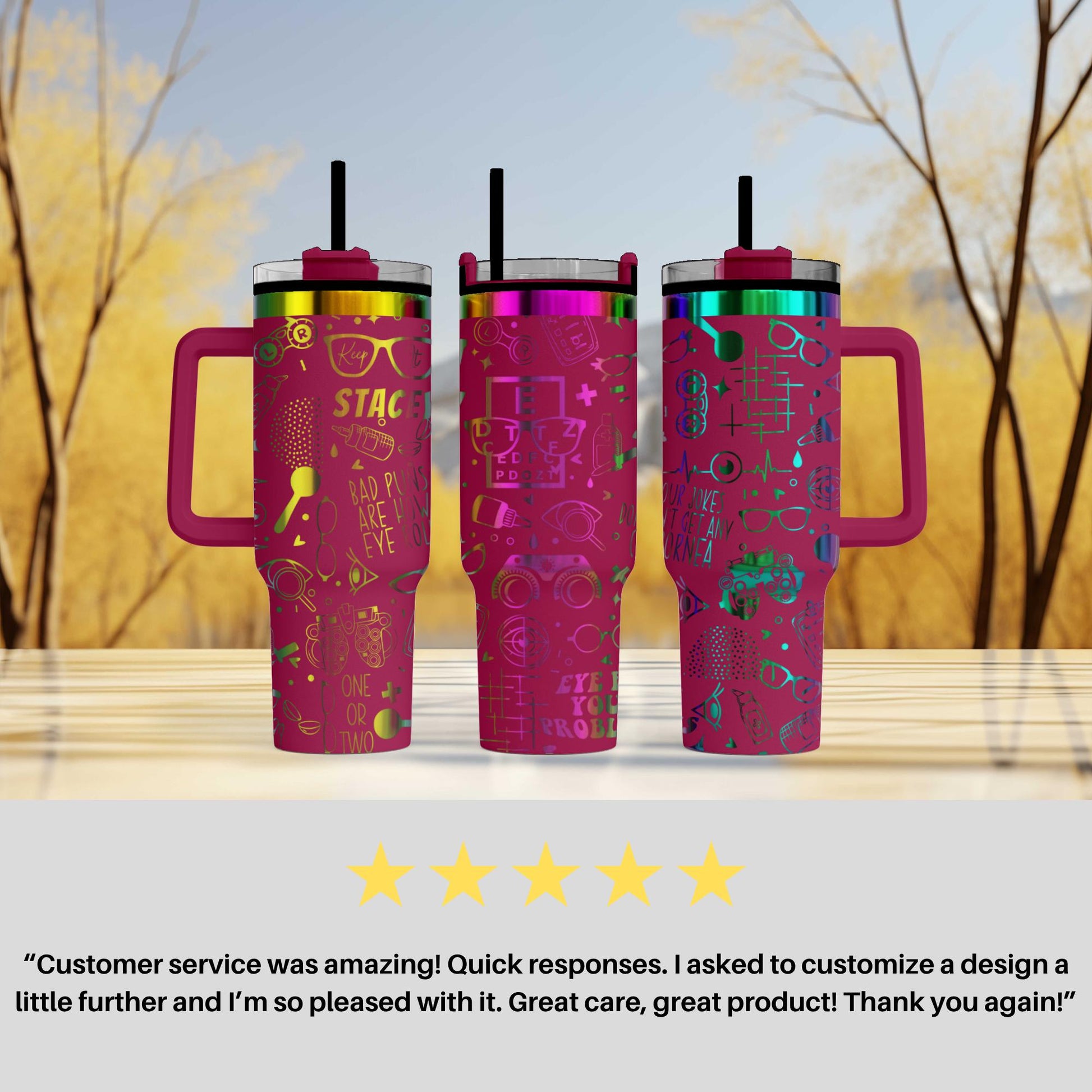 three colorful, patterned tumblers with handles, placed on a wooden surface against a blurred background of trees.