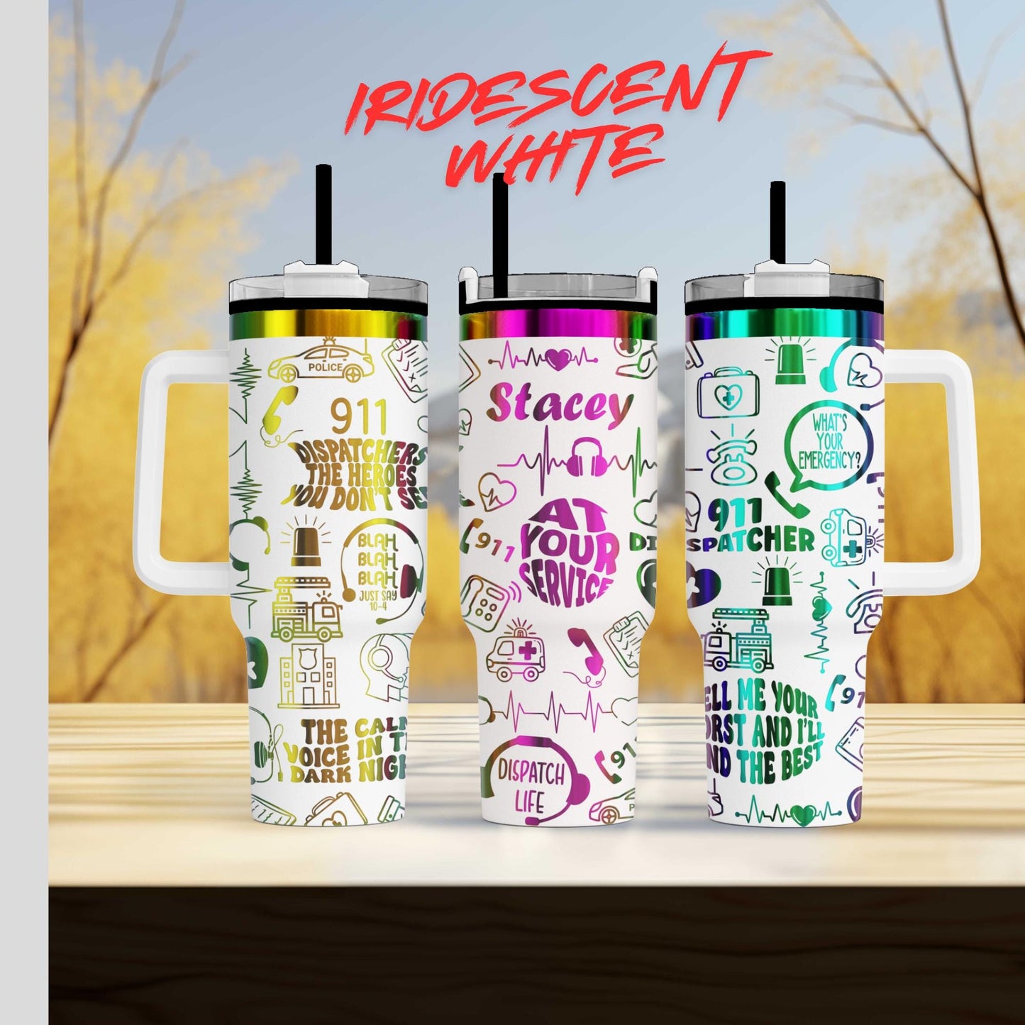 Three colorful tumblers with various designs and text on them, placed on a wooden surface against a blurred background.