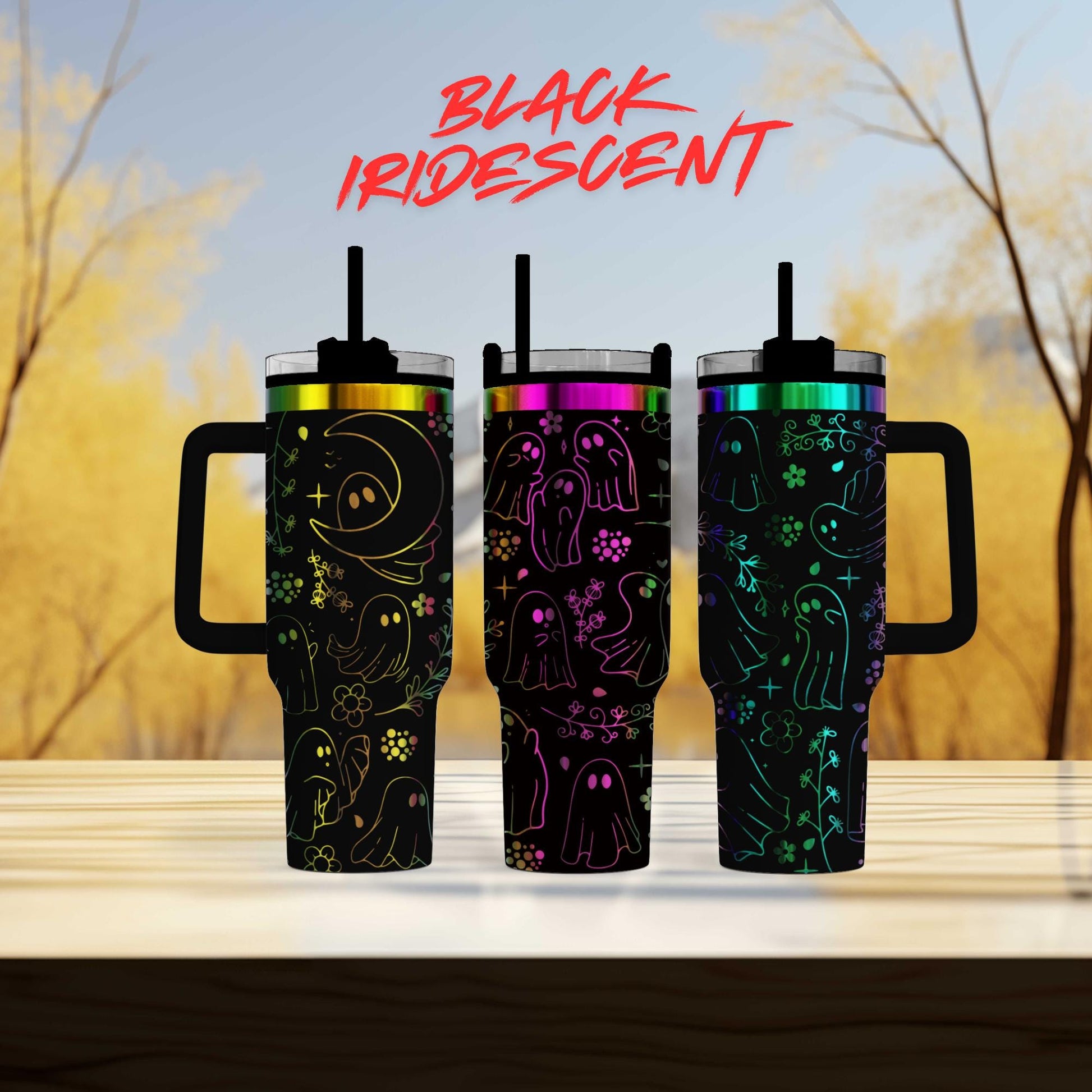 three colorful, patterned mugs with a Halloween-themed design, including ghost and spider motifs, against a blurred background of trees.