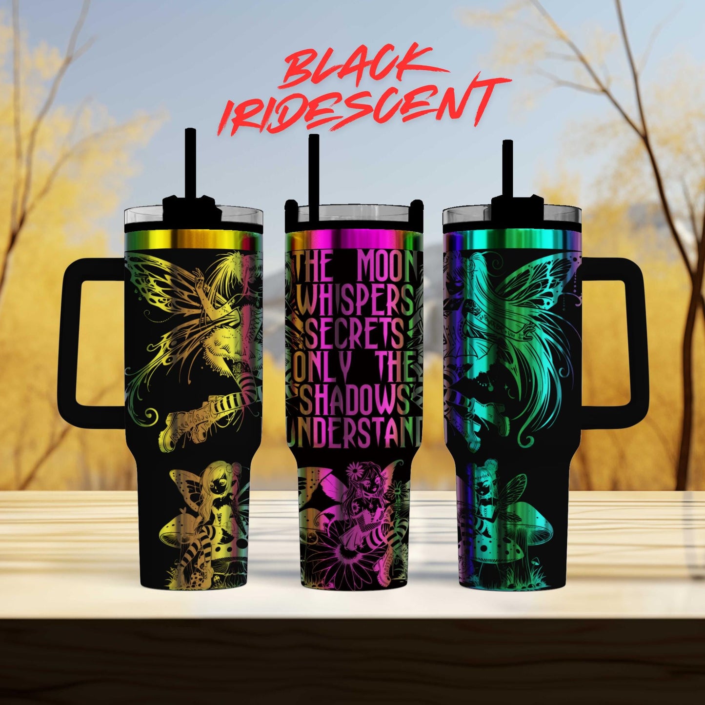 three colorful, patterned tumblers with handles, arranged in a row against a blurred background of trees.