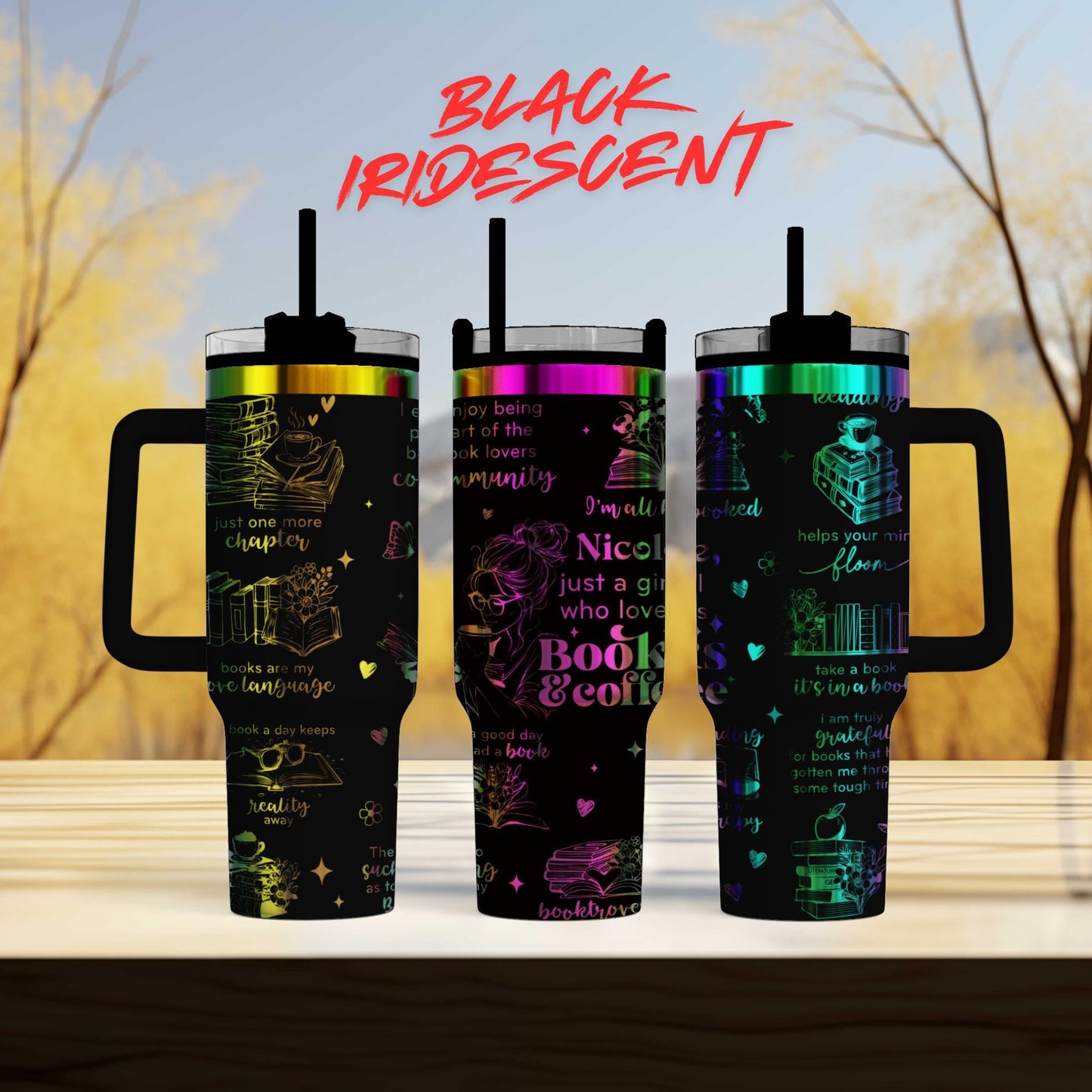 three colorful tumblers with various designs and text on them, set against a blurred background of trees.