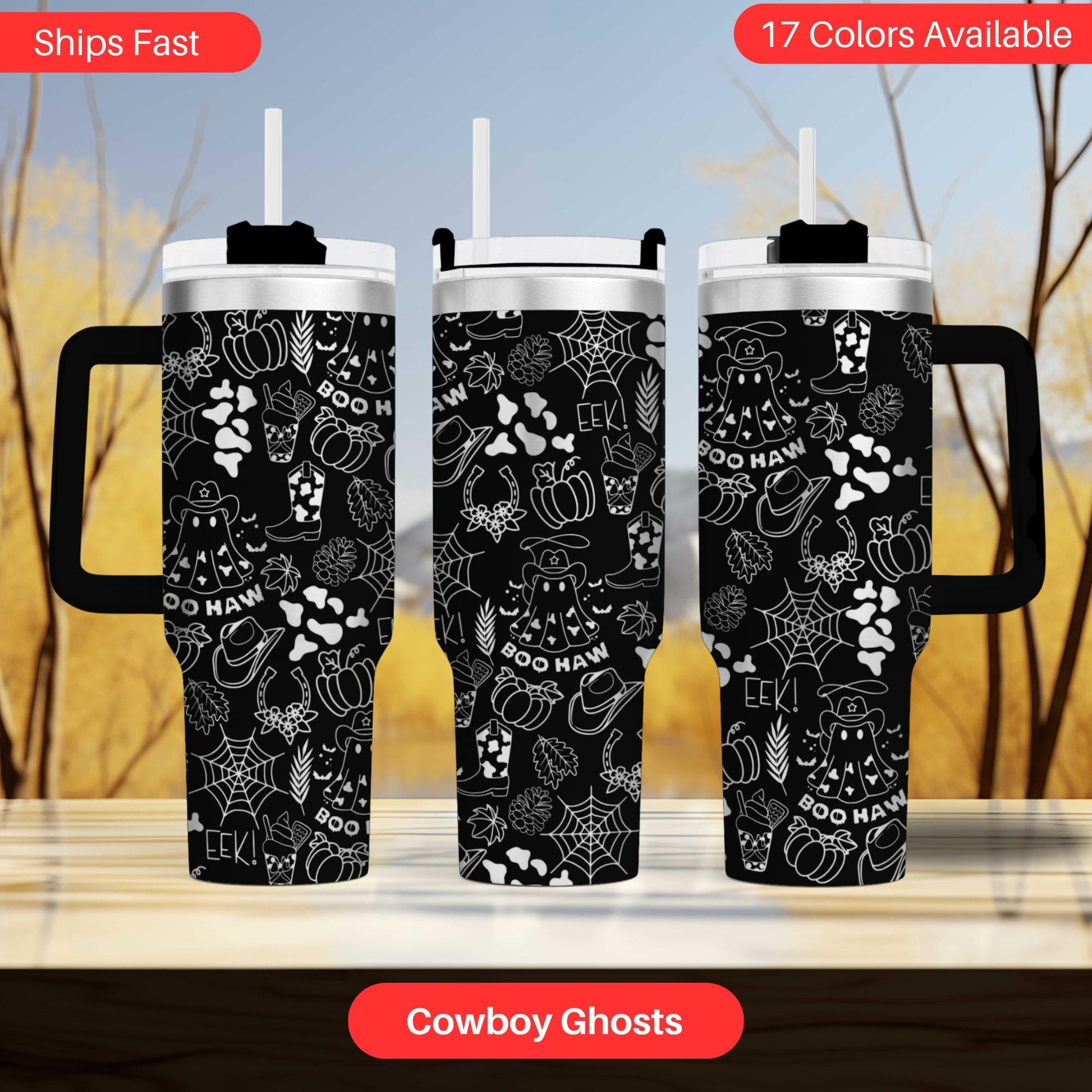 three black and white cowboy ghost themed tumblers, each with a handle and a straw. The tumblers are displayed against a blurred background, which appears to be a wooden surface.