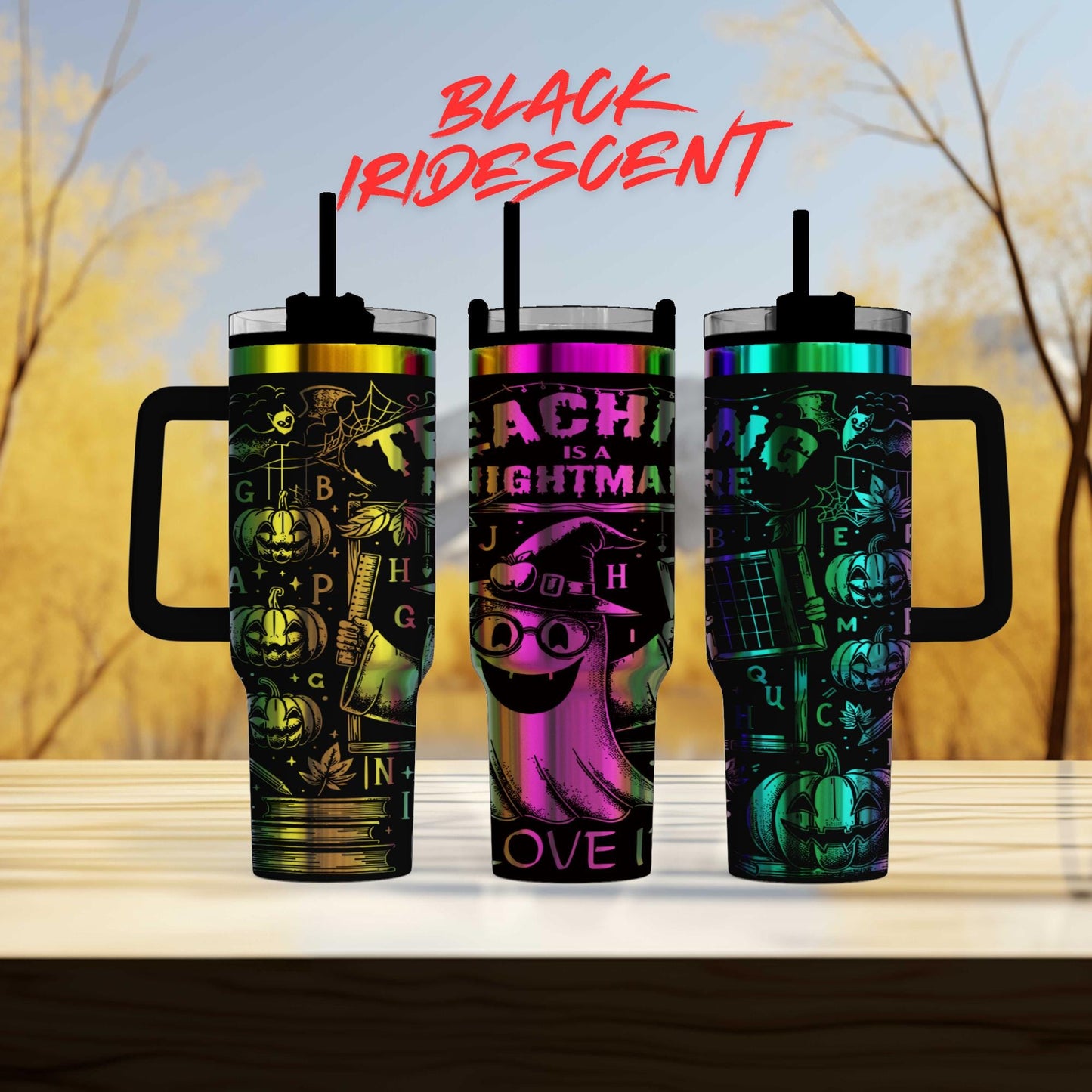 Three colorful tumblers with Halloween-themed designs, including bats, pumpkins, and other spooky elements, are displayed against a blurred background.