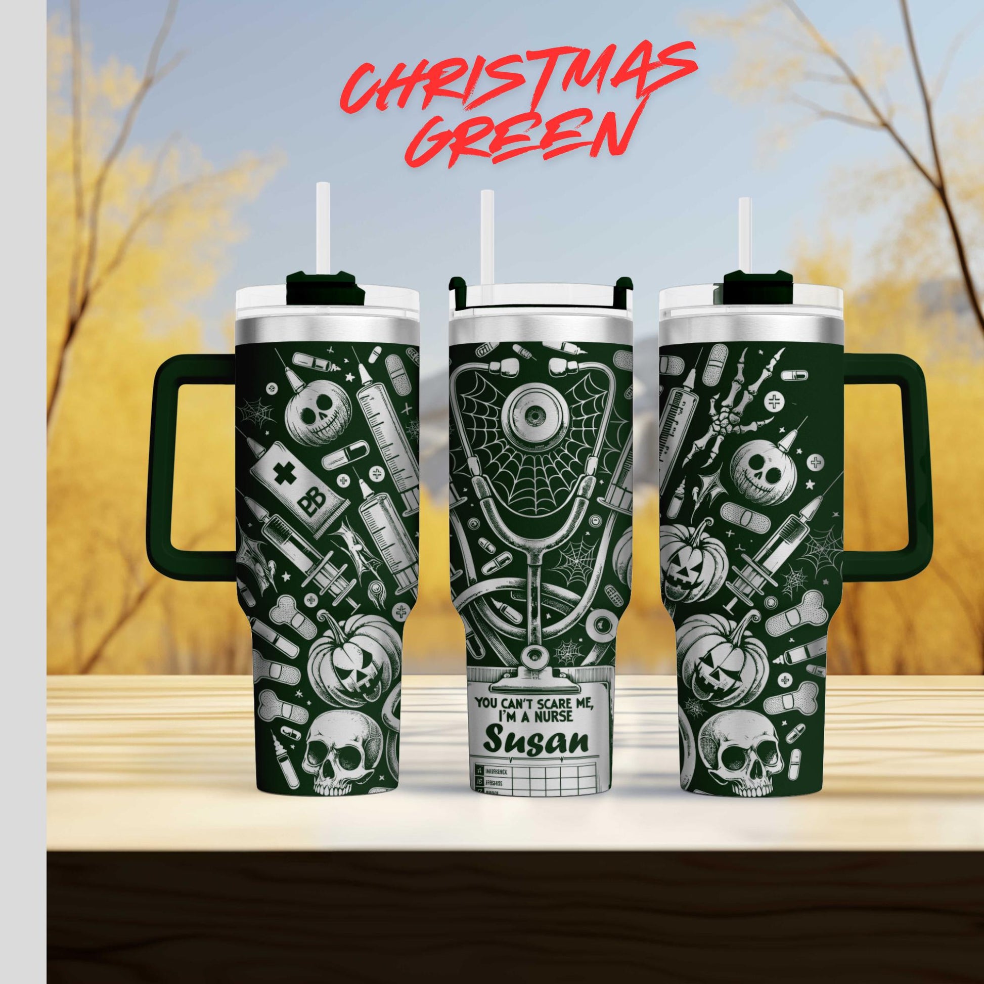 three green tumblers with various designs and text on them, set against a blurred background of trees and sky.