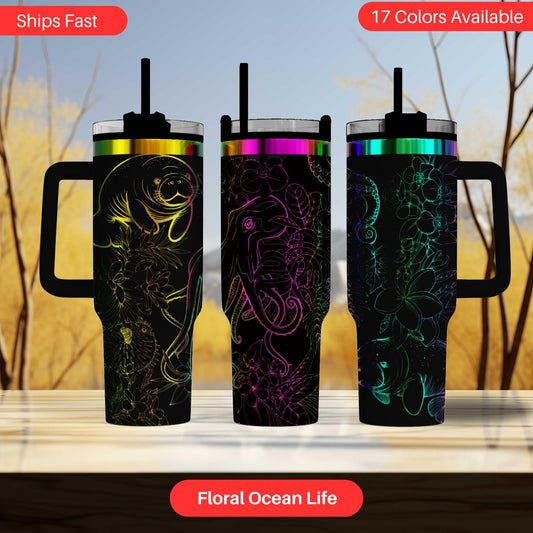 three colorful, patterned tumblers or mugs with various designs, including floral and ocean-themed patterns.