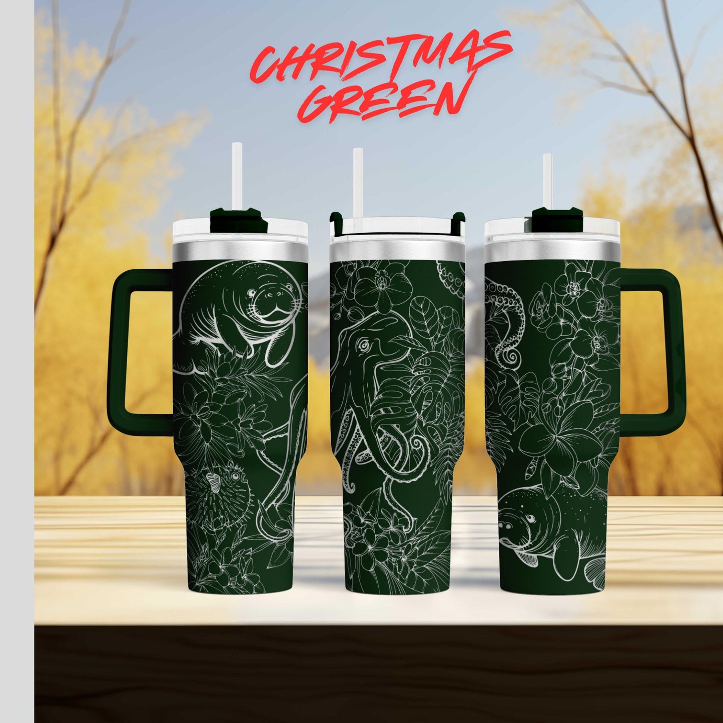 three green tumblers with floral designs on them, set against a blurred background of trees and a blue sky.