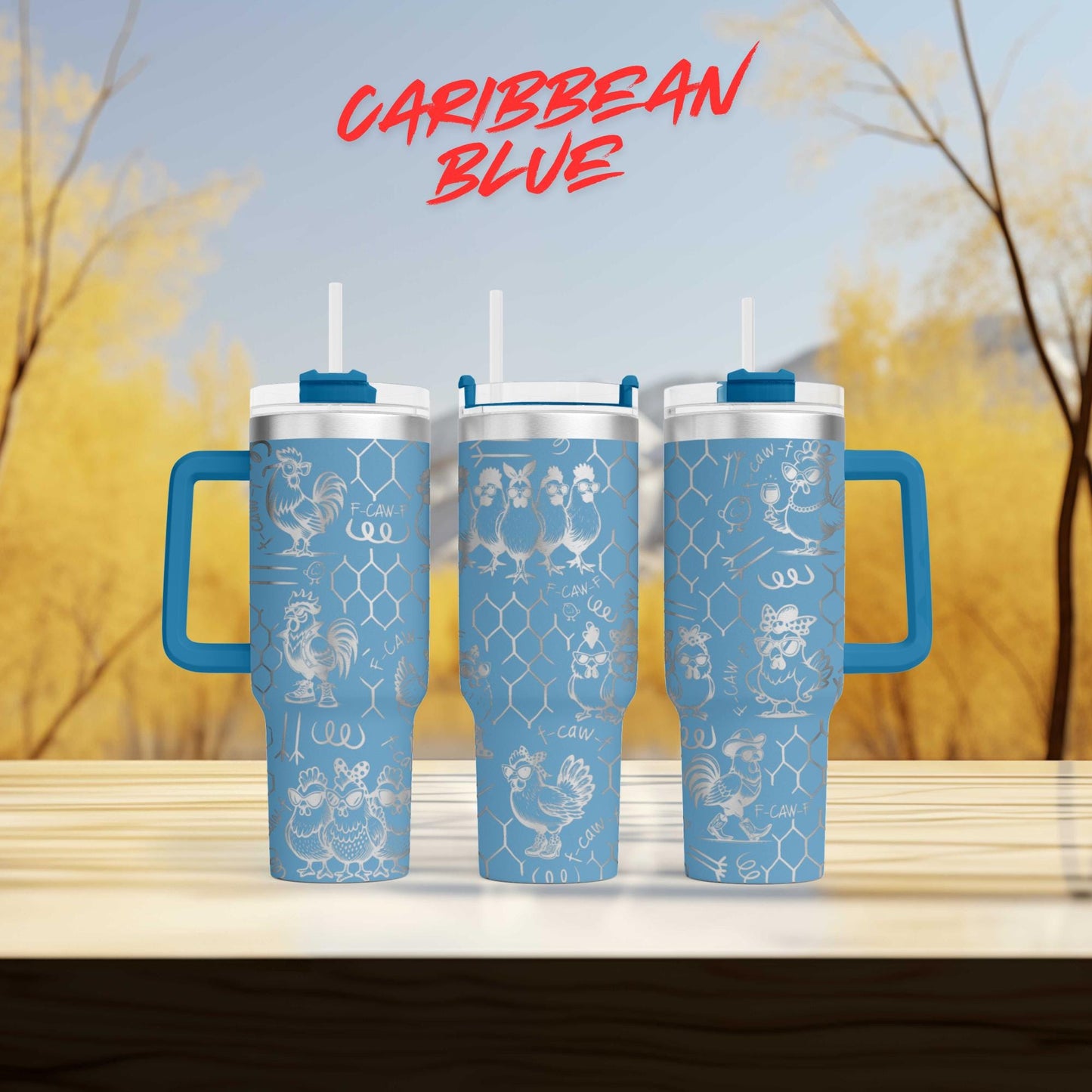 three blue insulated tumblers with handles, set against a blurred background of trees and foliage.