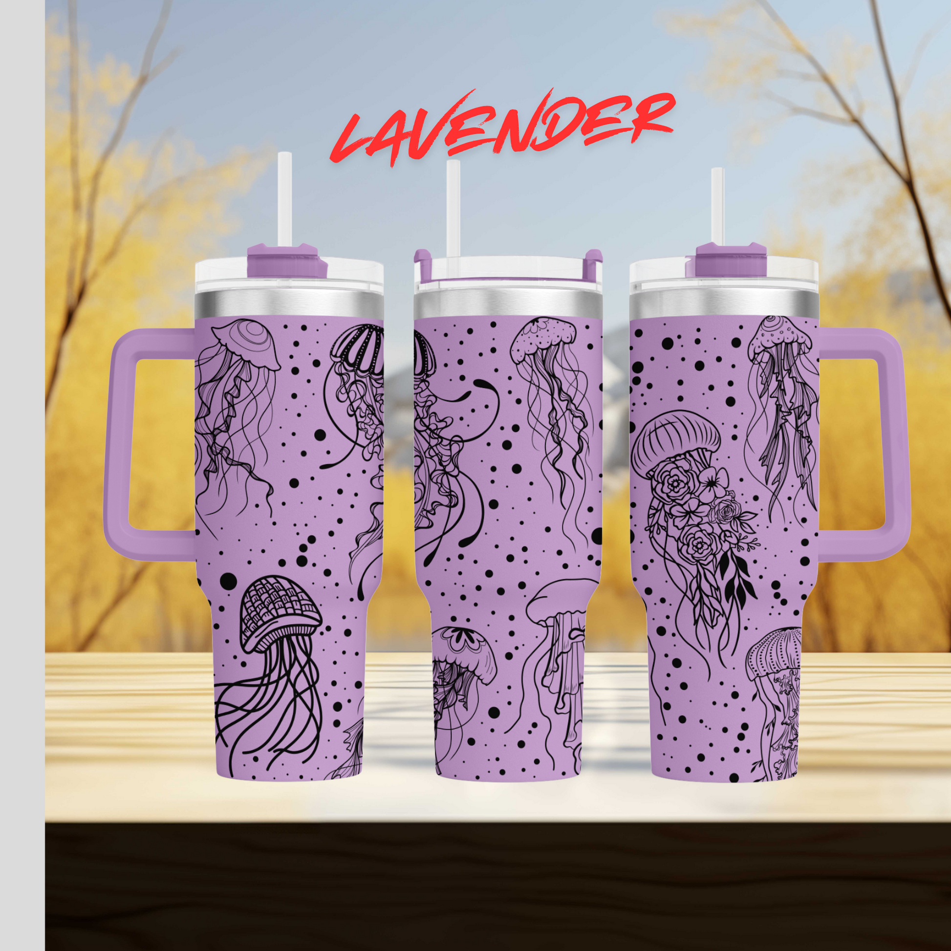 a set of three travel mugs sitting on top of a table