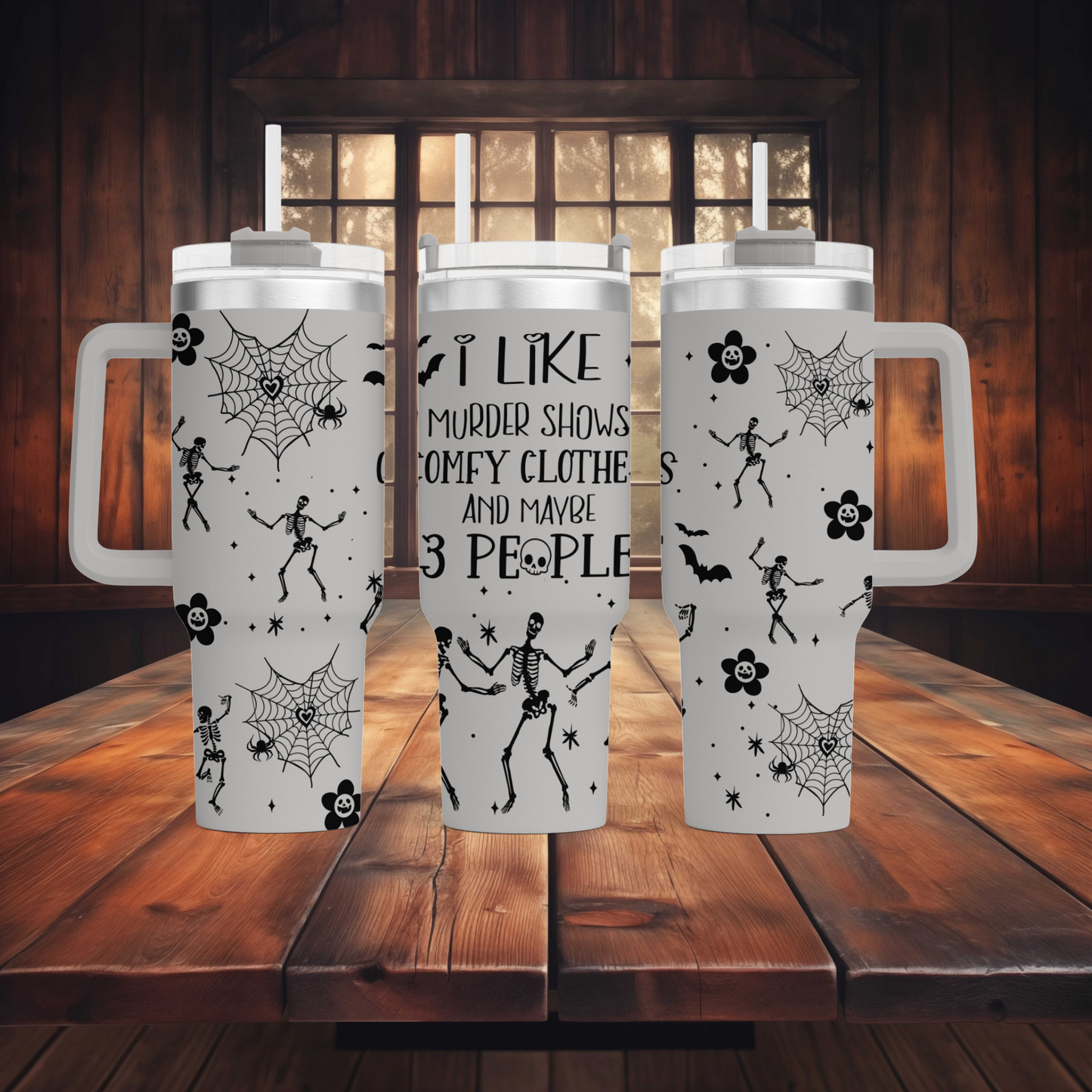 a couple of white coffee mugs sitting on top of a wooden table