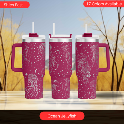 a set of three travel mugs sitting on top of a table